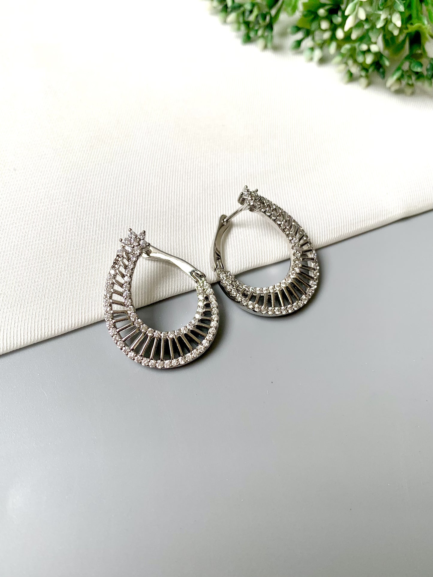 Astrella Hoops – Rhodium plated designer earrings with American Diamonds from Zamal Jewels FORMA Collection