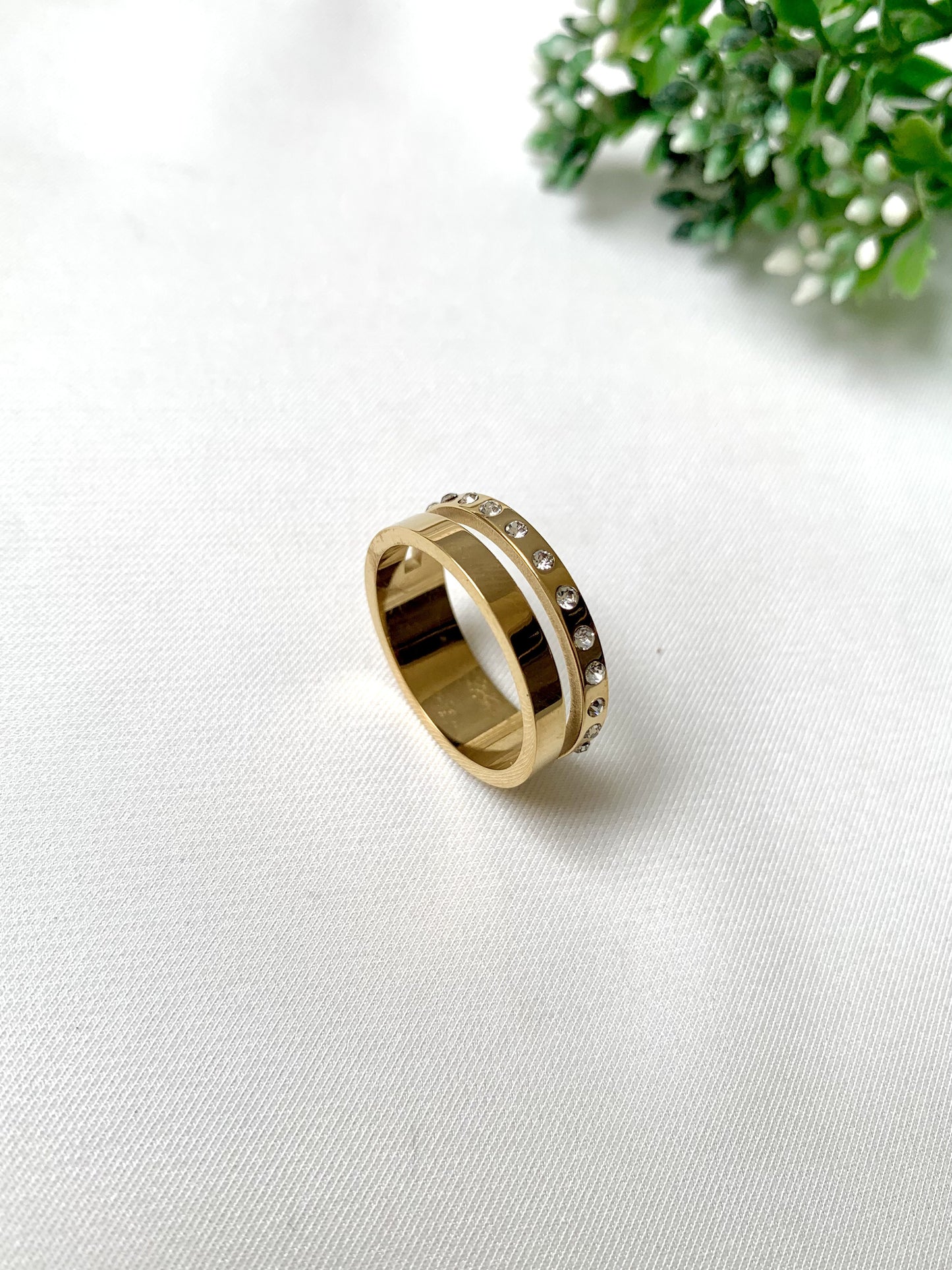 Aureo gold crystal band ring with dual-layer design, 22K gold plated on 316L stainless steel by Zamal Jewels.