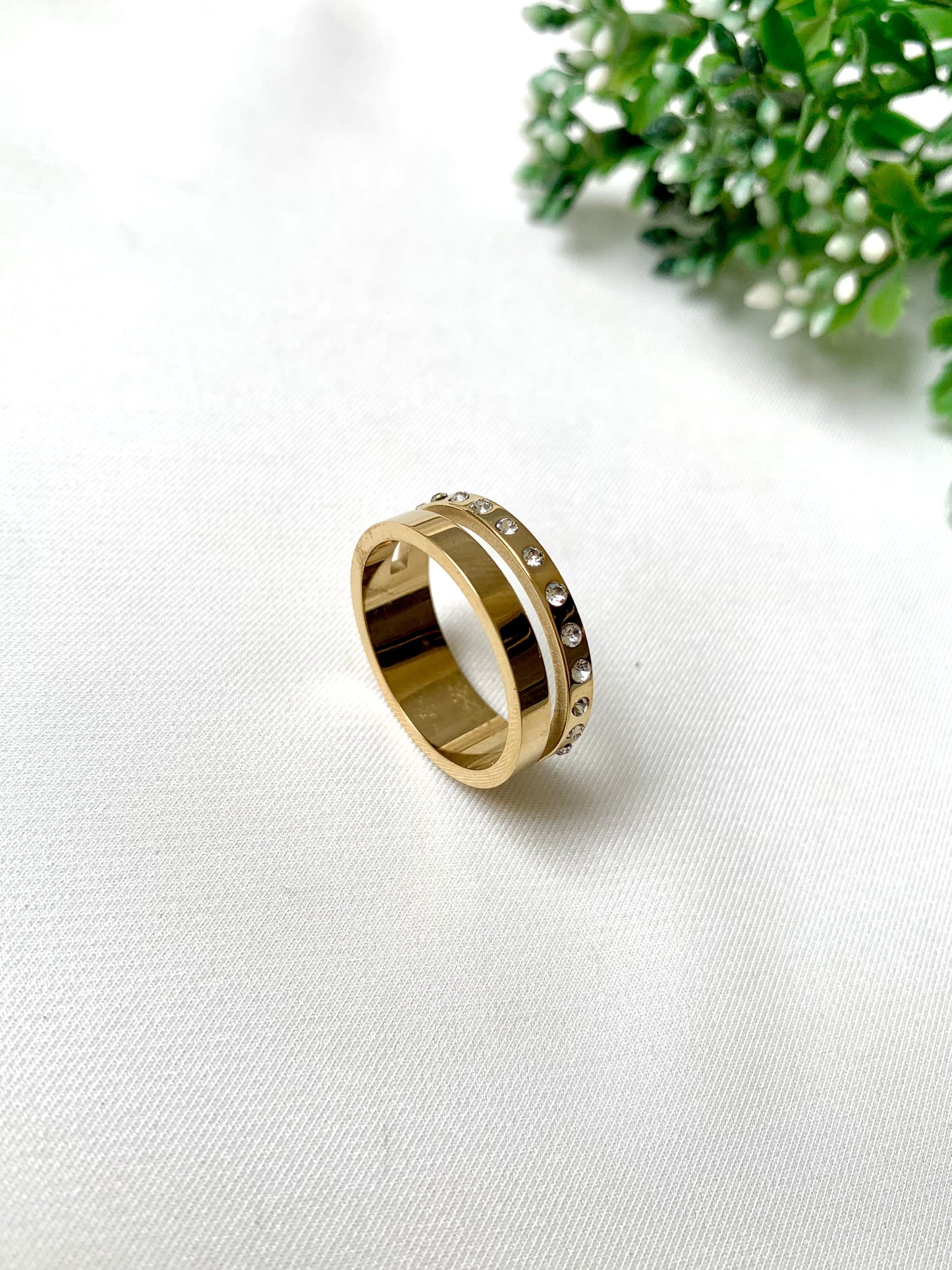 Aureo gold crystal band ring with dual-layer design, 22K gold plated on 316L stainless steel by Zamal Jewels.