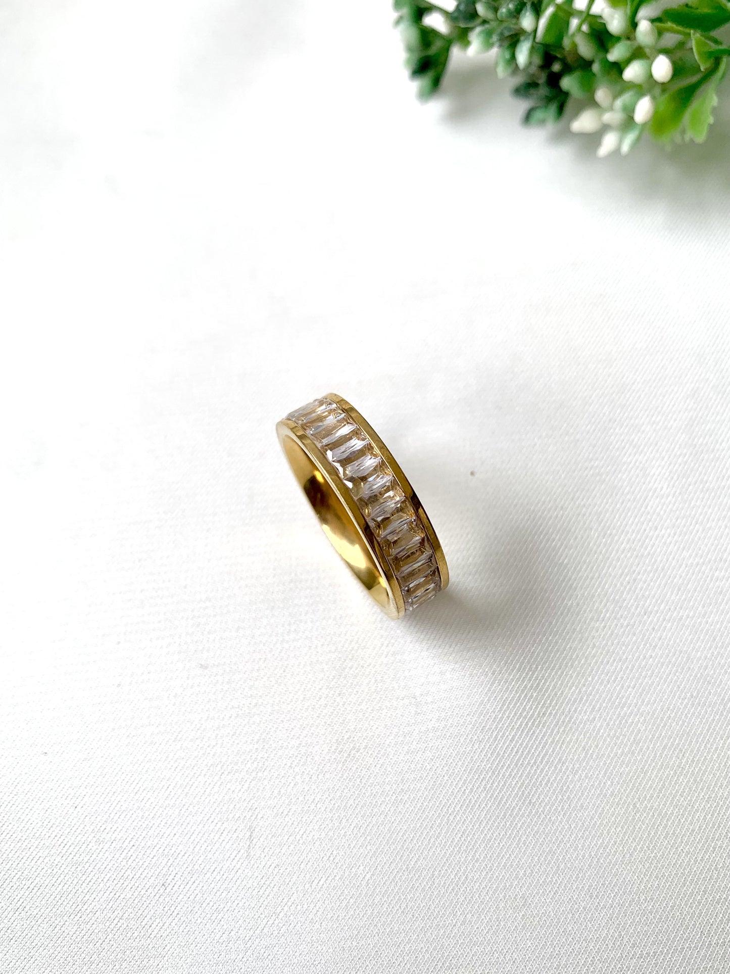 Brielle gold baguette-cut crystal band ring, 22K gold plated on 316L stainless steel by Zamal Jewels.