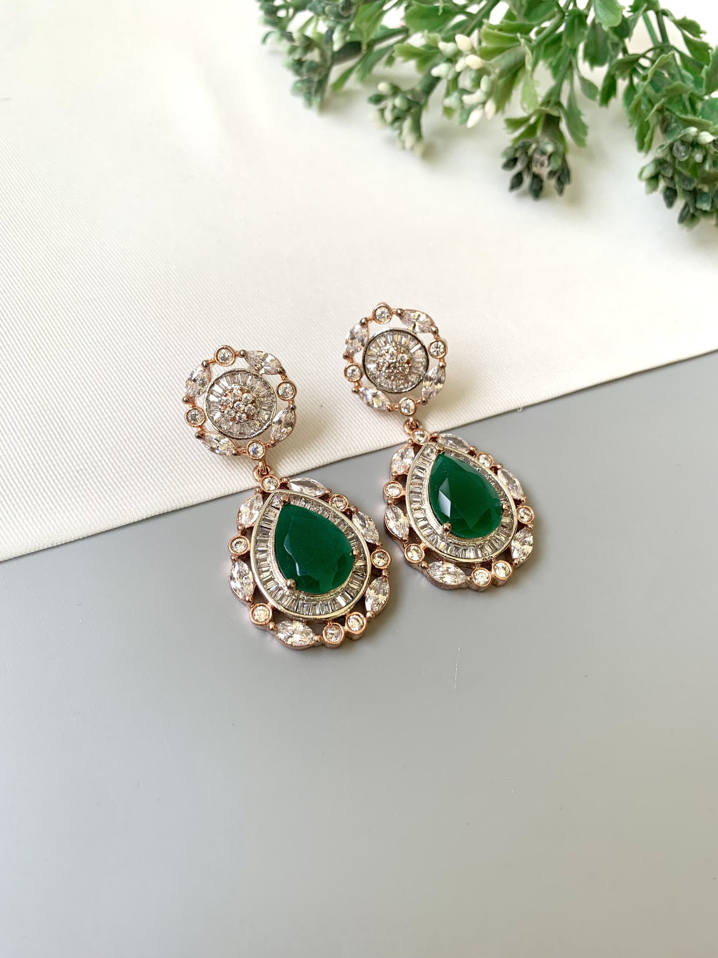 Handcrafted Victorian rose gold earrings with semi-precious emeralds and American diamonds by Zamal Jewels.
