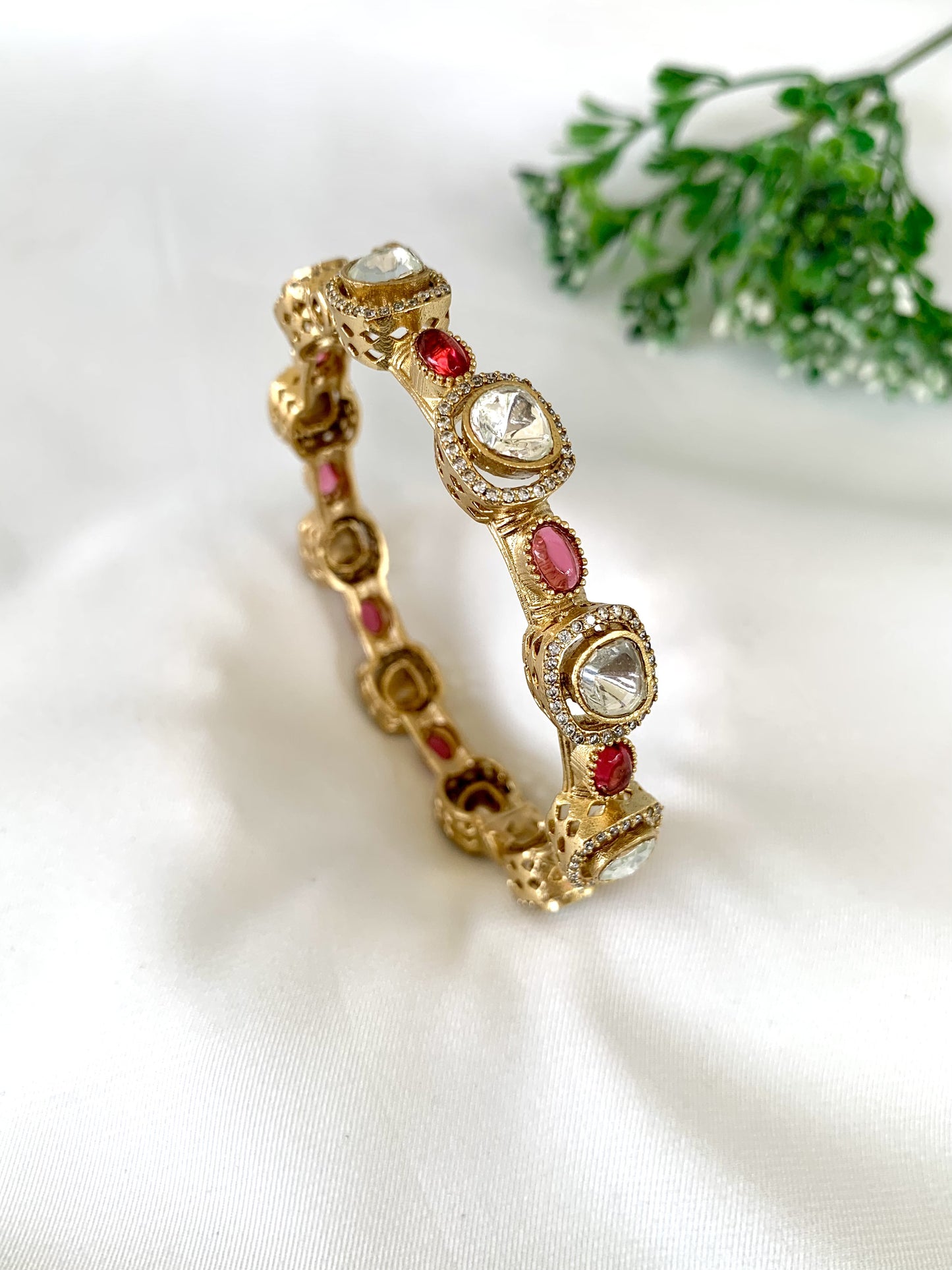 22kt gold plated bangle with semi-precious ruby and cutwork sides