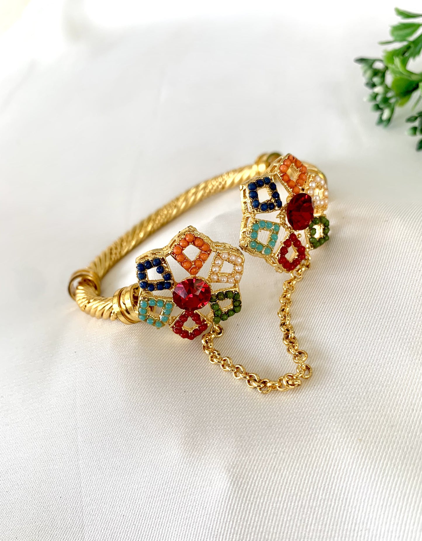 Colorful 22kt gold plated bangle with red, blue, green stones