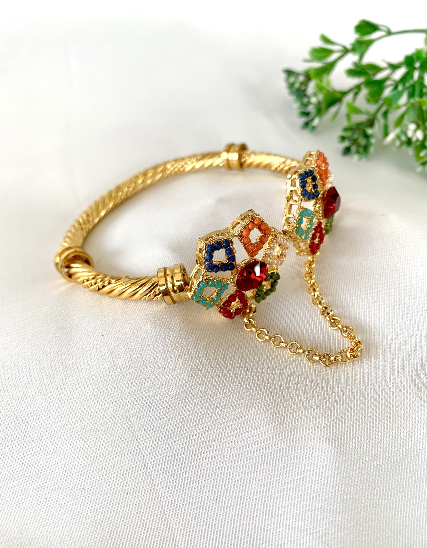 Colorful 22kt gold plated bangle with red, blue, green stones