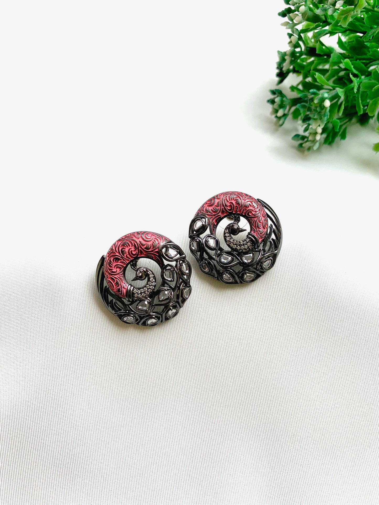 Madhu handcrafted peacock studs with American Diamonds, Polki Kundan and hand-painted Meena in black oxidized rhodium finish