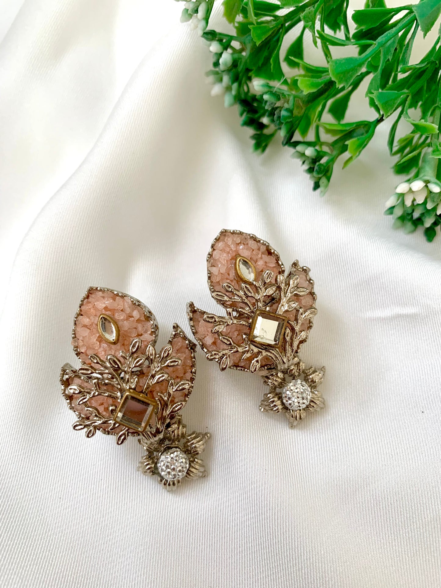 Naghma handcrafted earrings featuring American Diamonds, Kundan, and semi-precious Pearls, available in White (22kt gold plated) and Pink (rhodium plated) variants