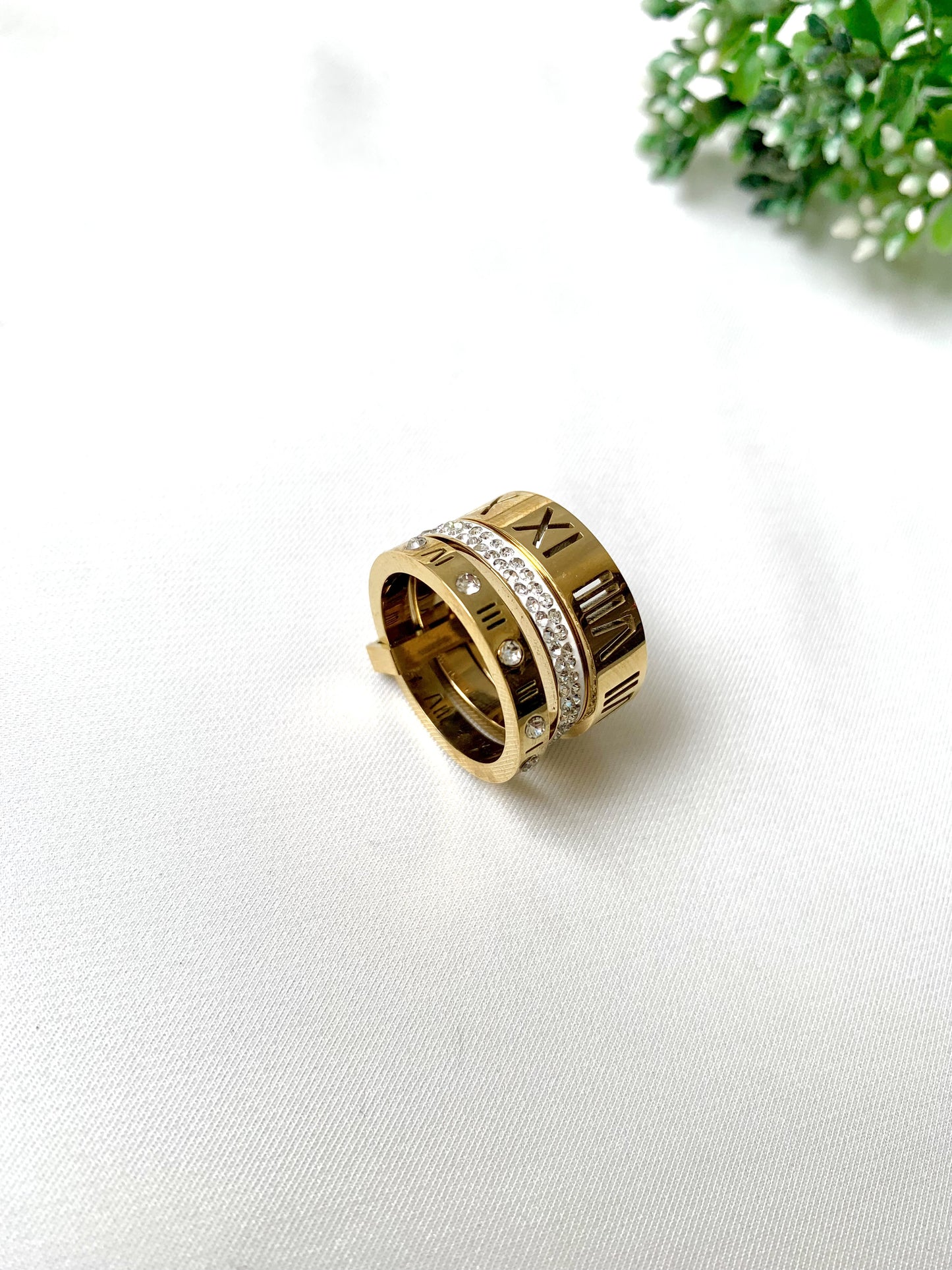 Roma gold ring set with Roman numeral engravings and crystal accents, 22K gold plated on 316L stainless steel by Zamal Jewels.
