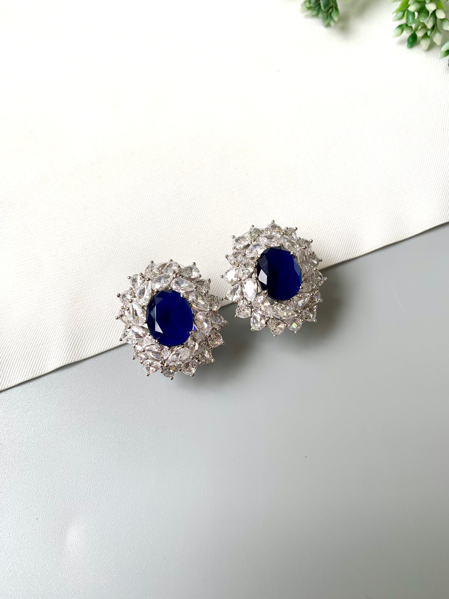 Close-up of handcrafted Sapphire and Diamond Stud Earrings