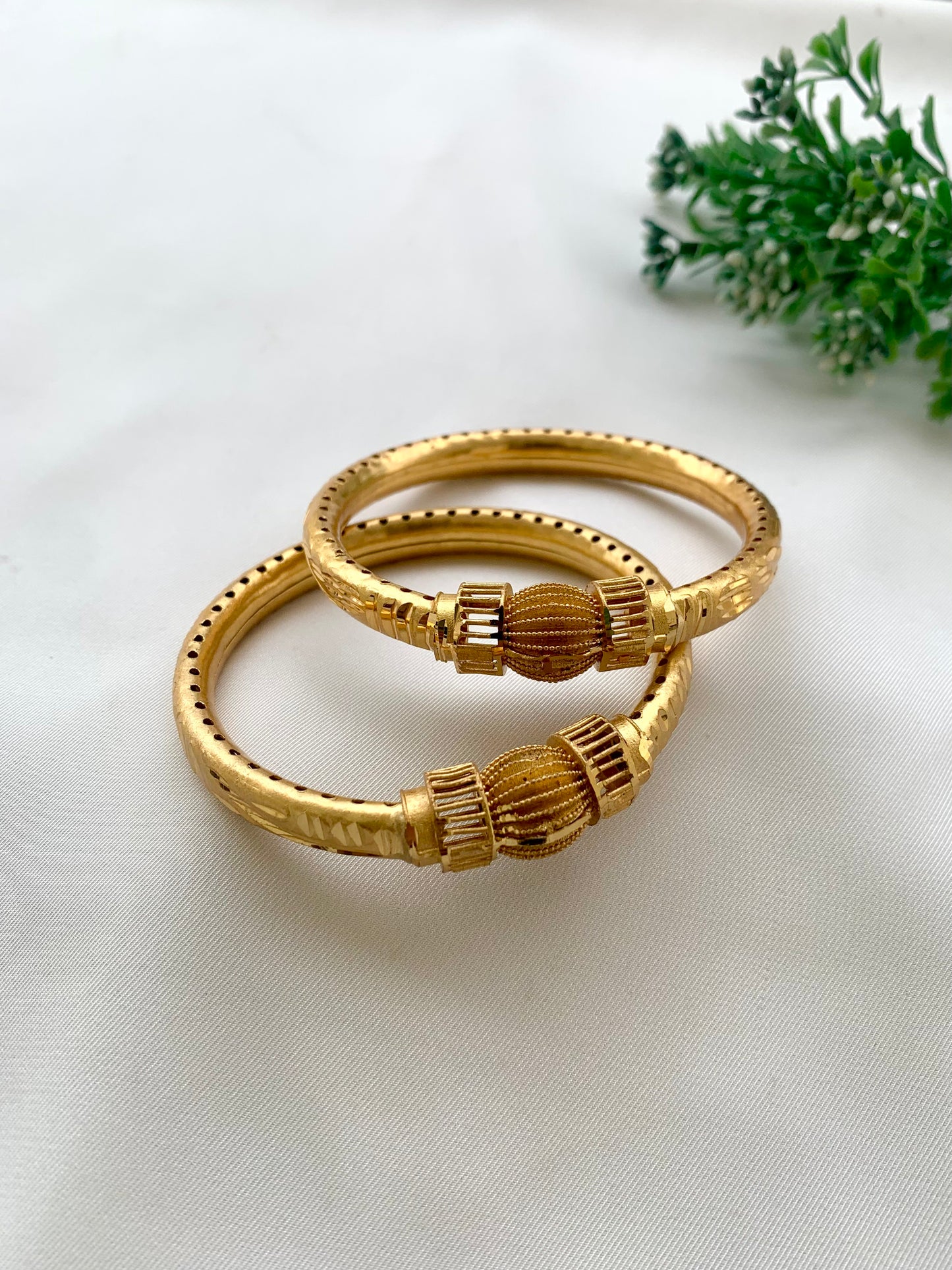 Shaina handcrafted lightweight 22kt gold plated bangles sold as a pair and available in sizes 2.4, 2.6, and 2.8