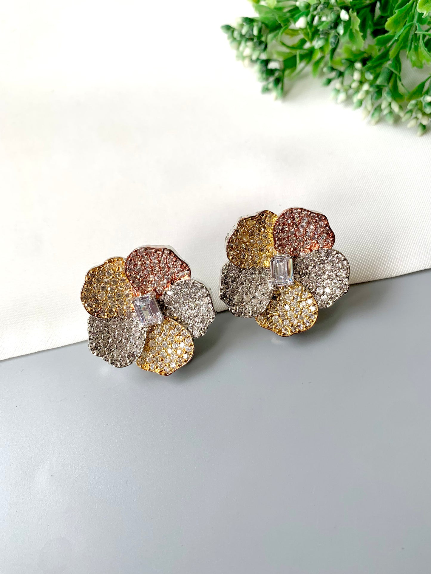 Hand-crafted pavé American Diamond blossom studs with baguette center in dual-tone 22kt gold and rose-gold — Zamal Jewels