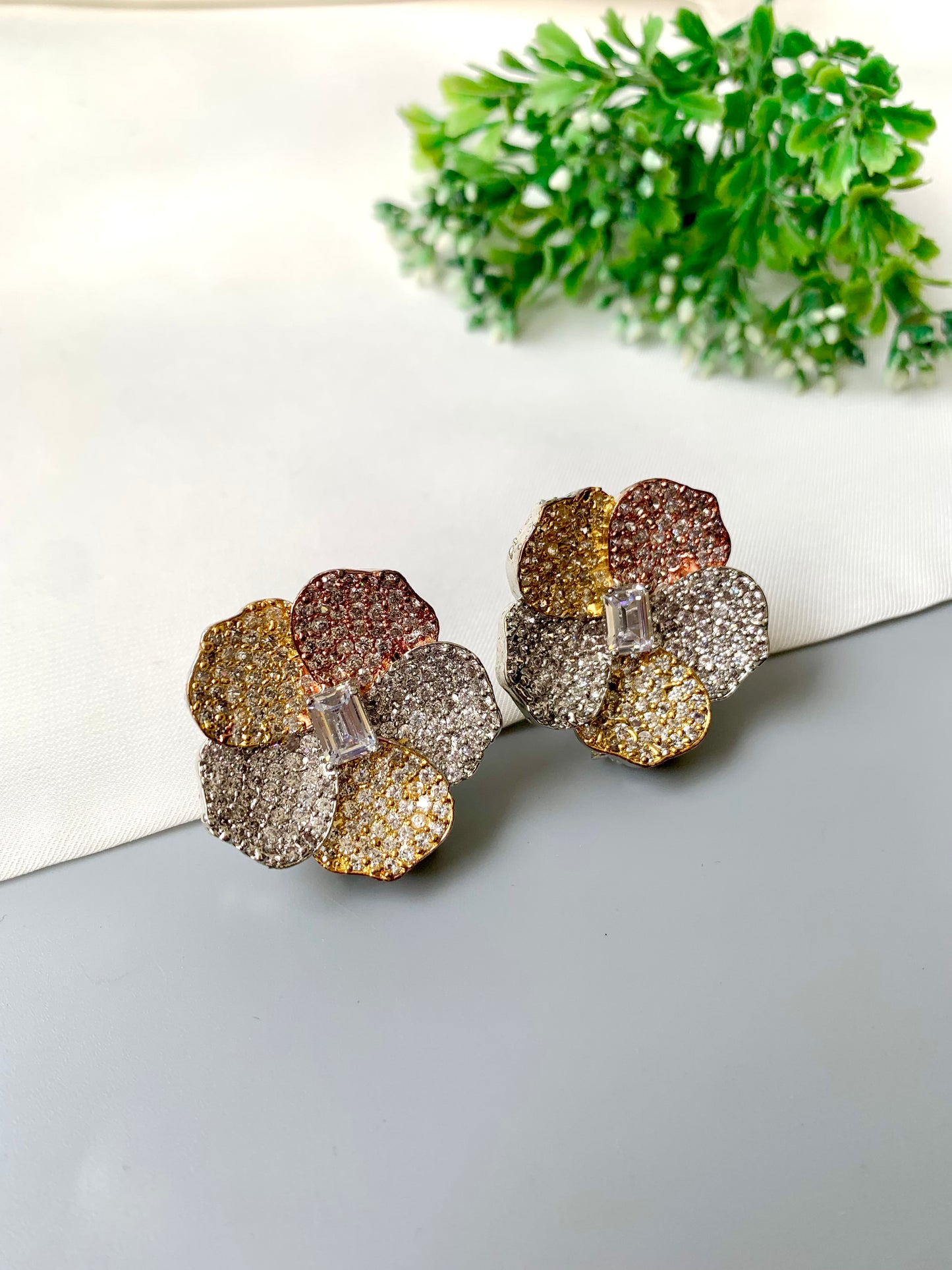 Hand-crafted pavé American Diamond blossom studs with baguette center in dual-tone 22kt gold and rose-gold — Zamal Jewels