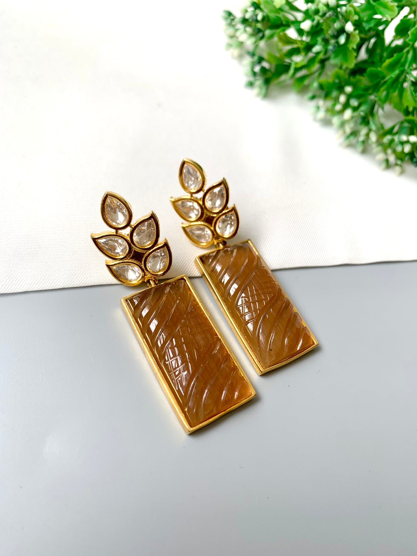 Kaelis Earrings by Zamal Jewels – handcrafted 22kt gold plated earrings with Polki Kundan and hand-carved rectangular orange onyx drops