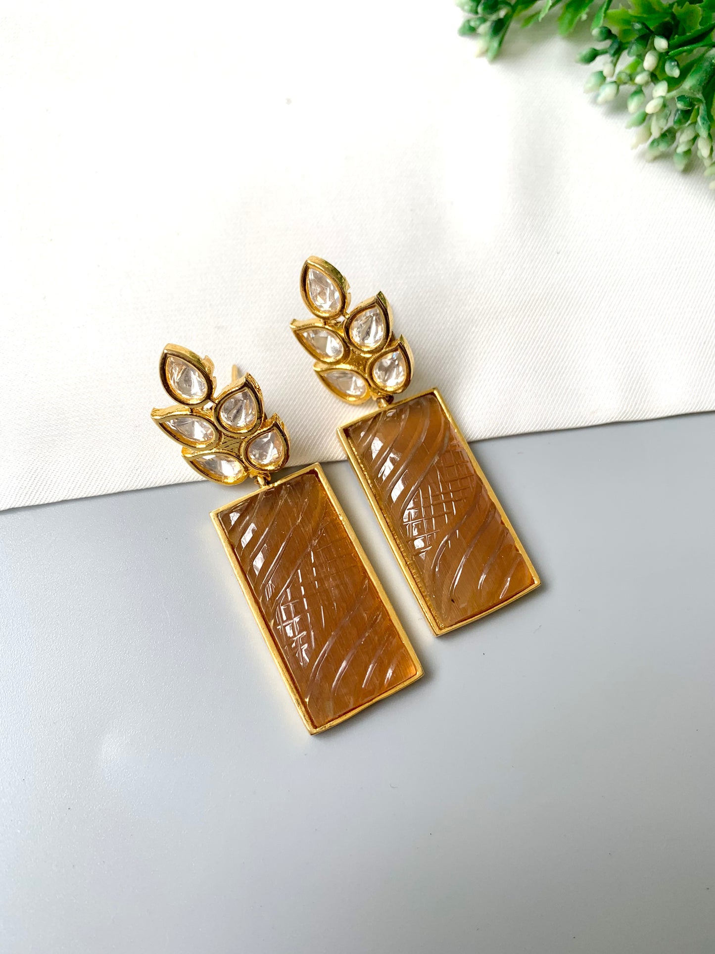 Kaelis Earrings by Zamal Jewels – handcrafted 22kt gold plated earrings with Polki Kundan and hand-carved rectangular orange onyx drops