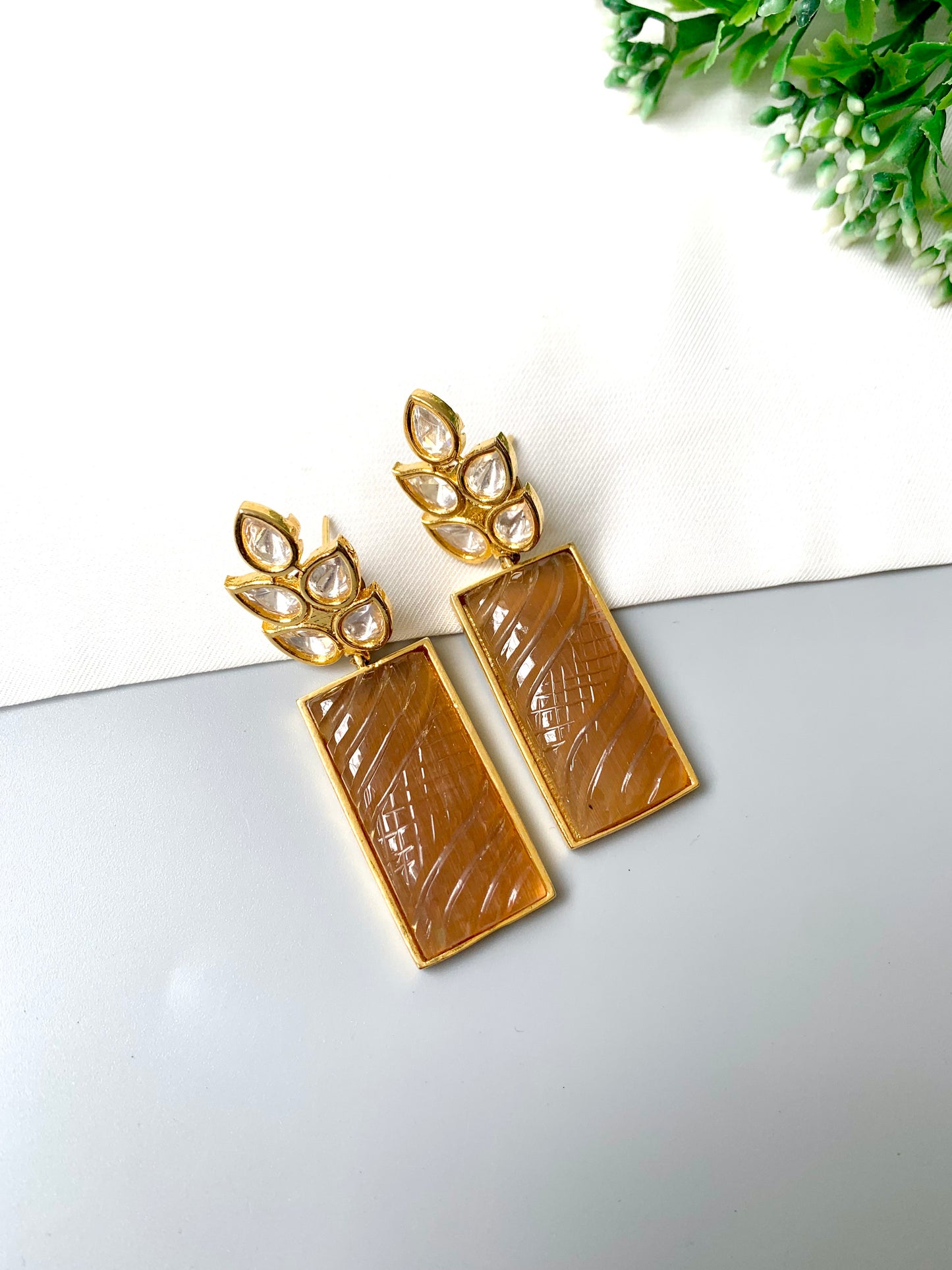 Kaelis Earrings by Zamal Jewels – handcrafted 22kt gold plated earrings with Polki Kundan and hand-carved rectangular orange onyx drops