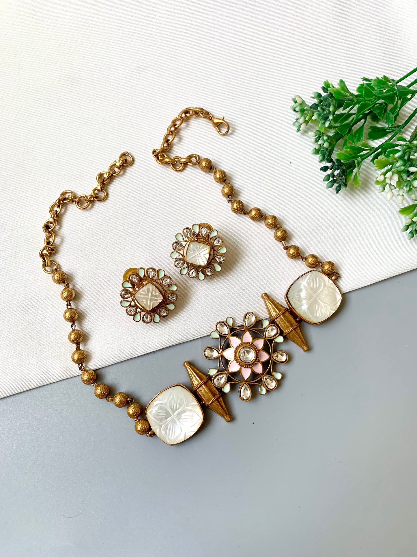 Designer choker with semi-precious amethyst, hand-painted Meena, and Polki Kundan stones in antique gold finish