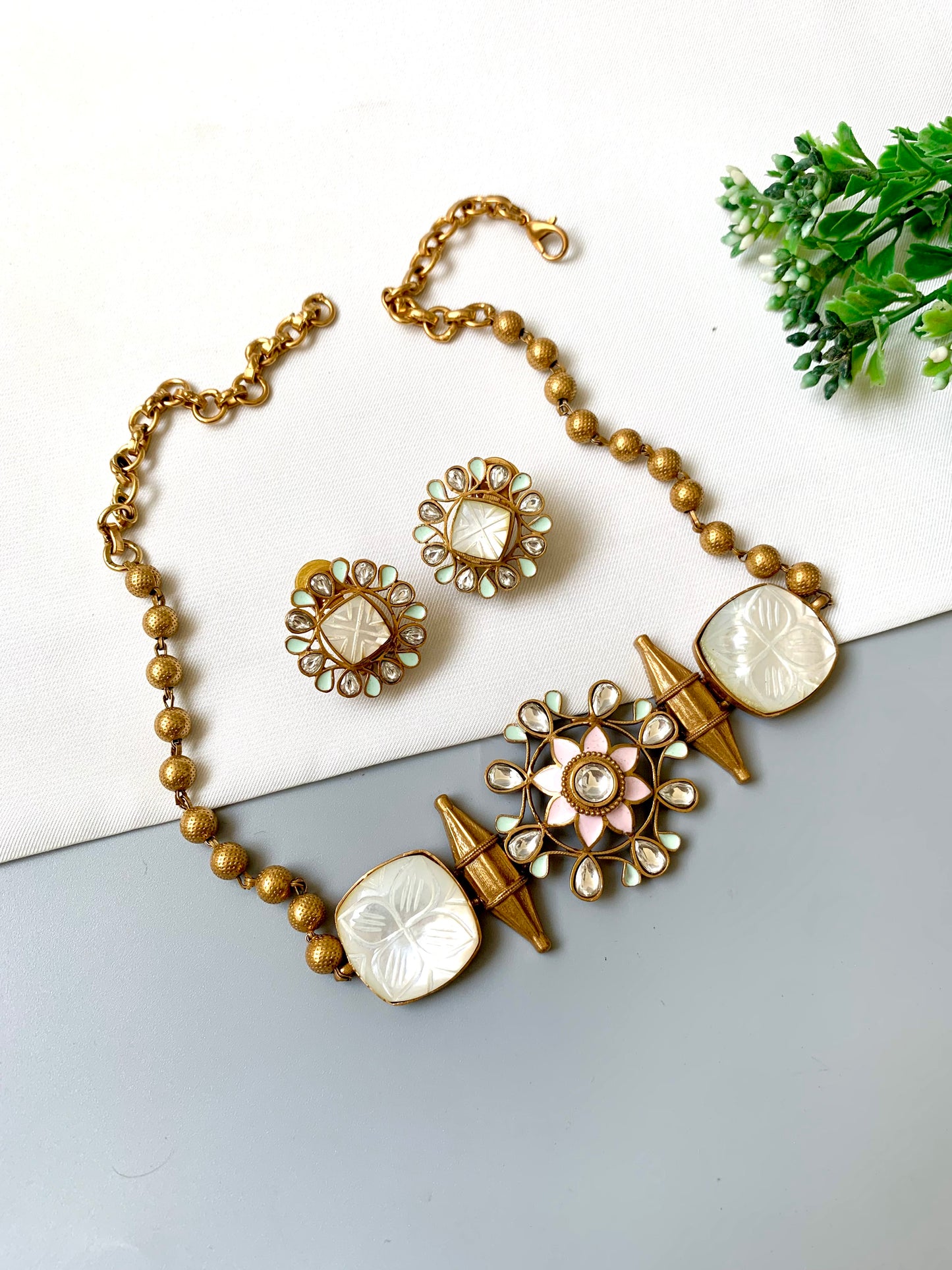 Close-up of floral Polki Kundan centerpiece with Meena detailing and carved amethyst in Ameera Choker Set