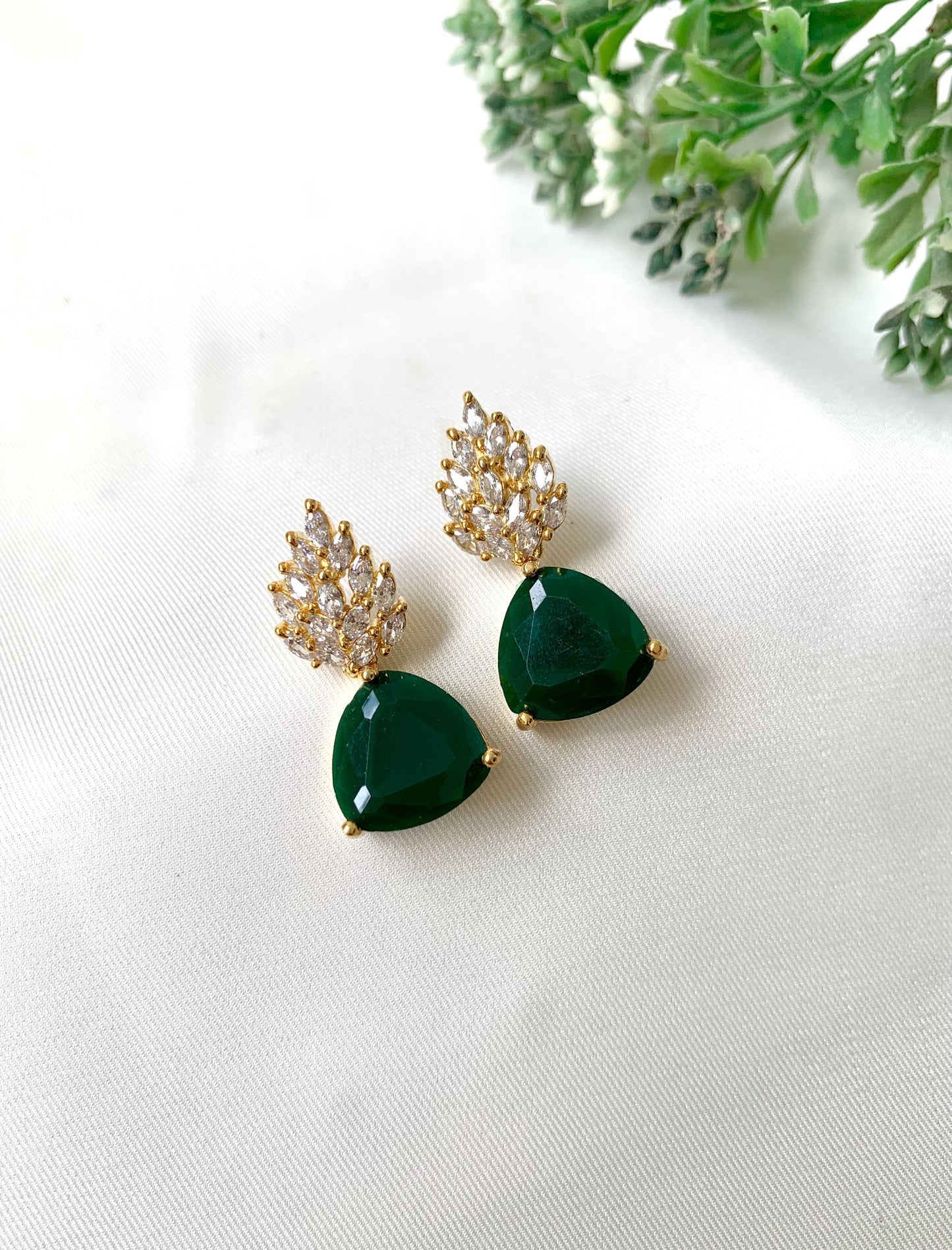Handcrafted designer earrings with emerald stone and diamond cluster top