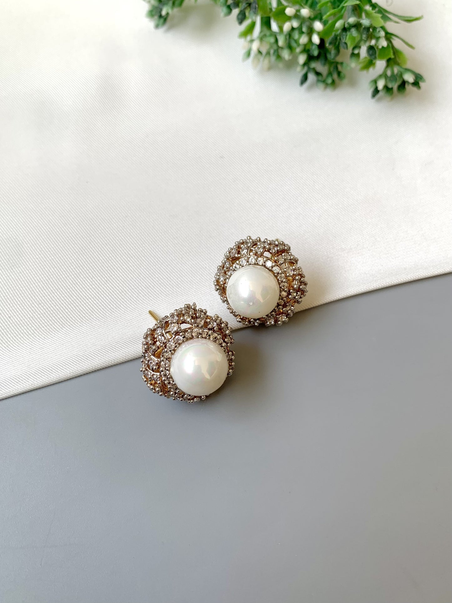 Belle signature pearl studs with American diamonds in rose tone setting