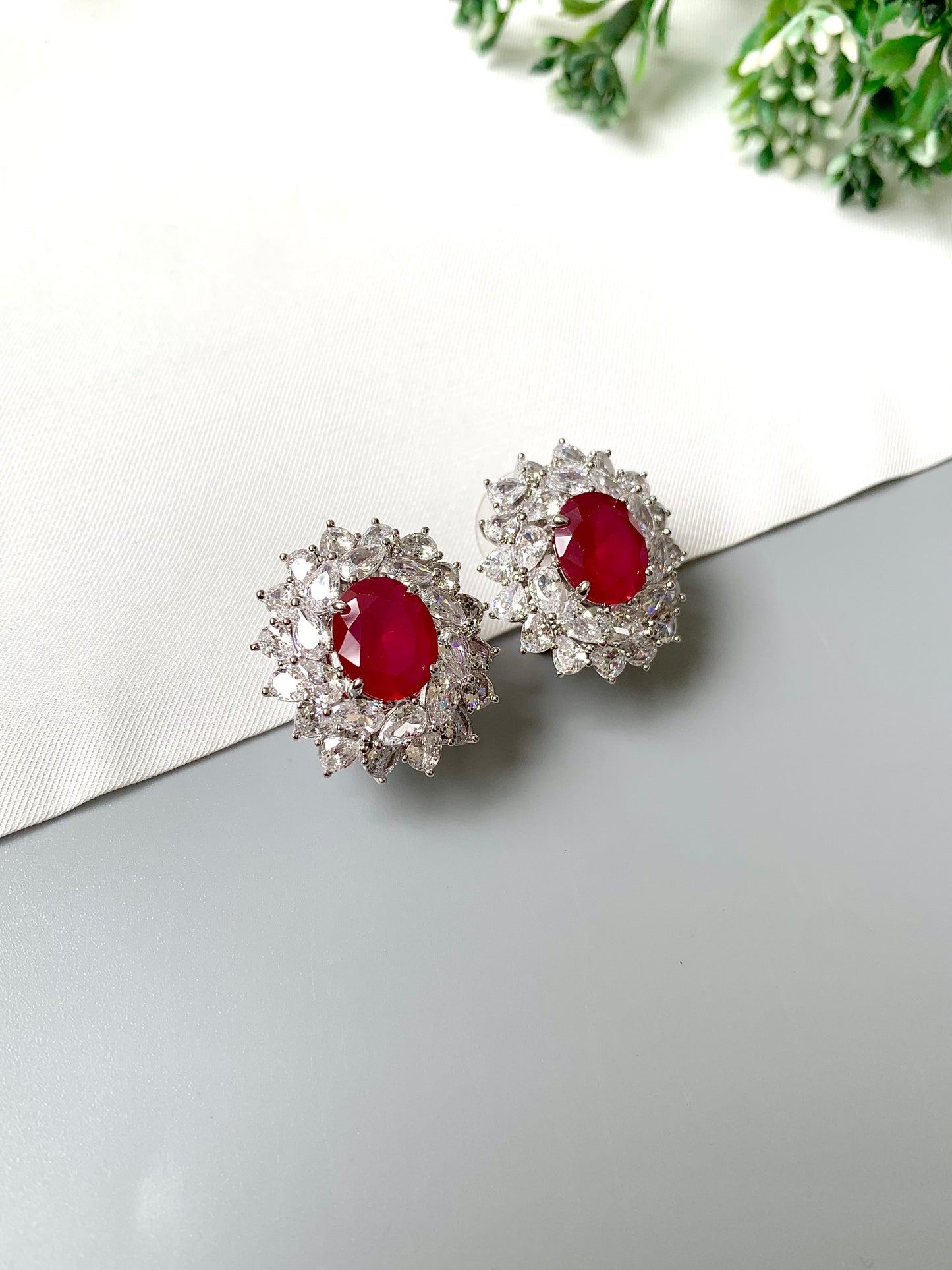 Elegant crimson radiance stud earrings by Zamal Jewels – angled view