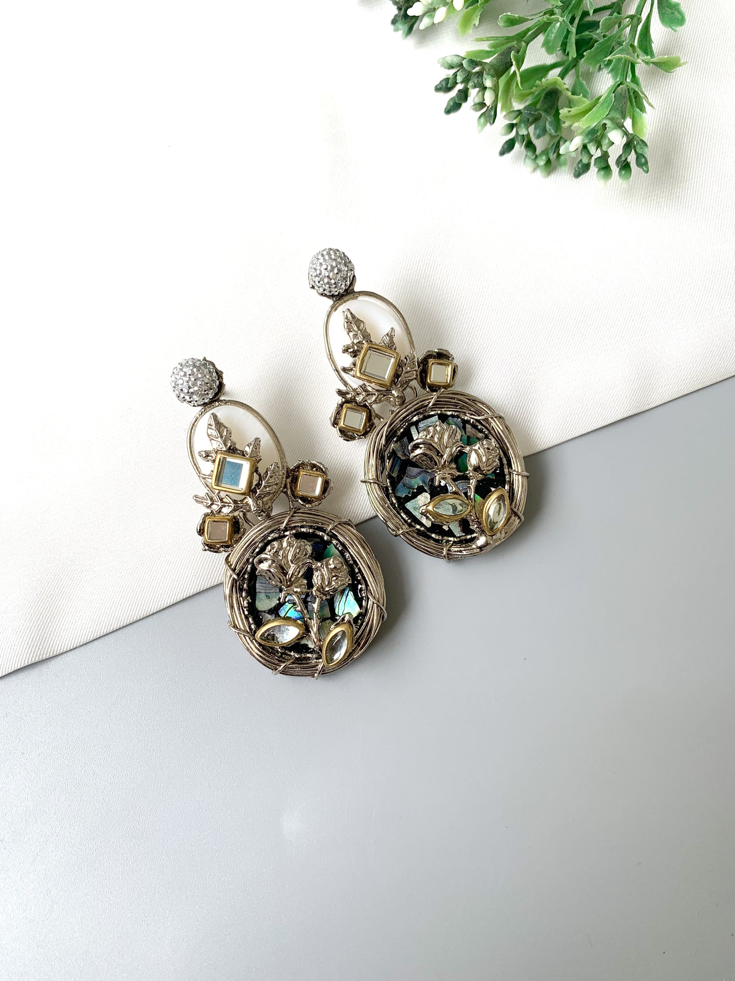 Close-up image of Elara Bloom earrings showing mother of pearl, Kundan, and handcrafted floral work.
