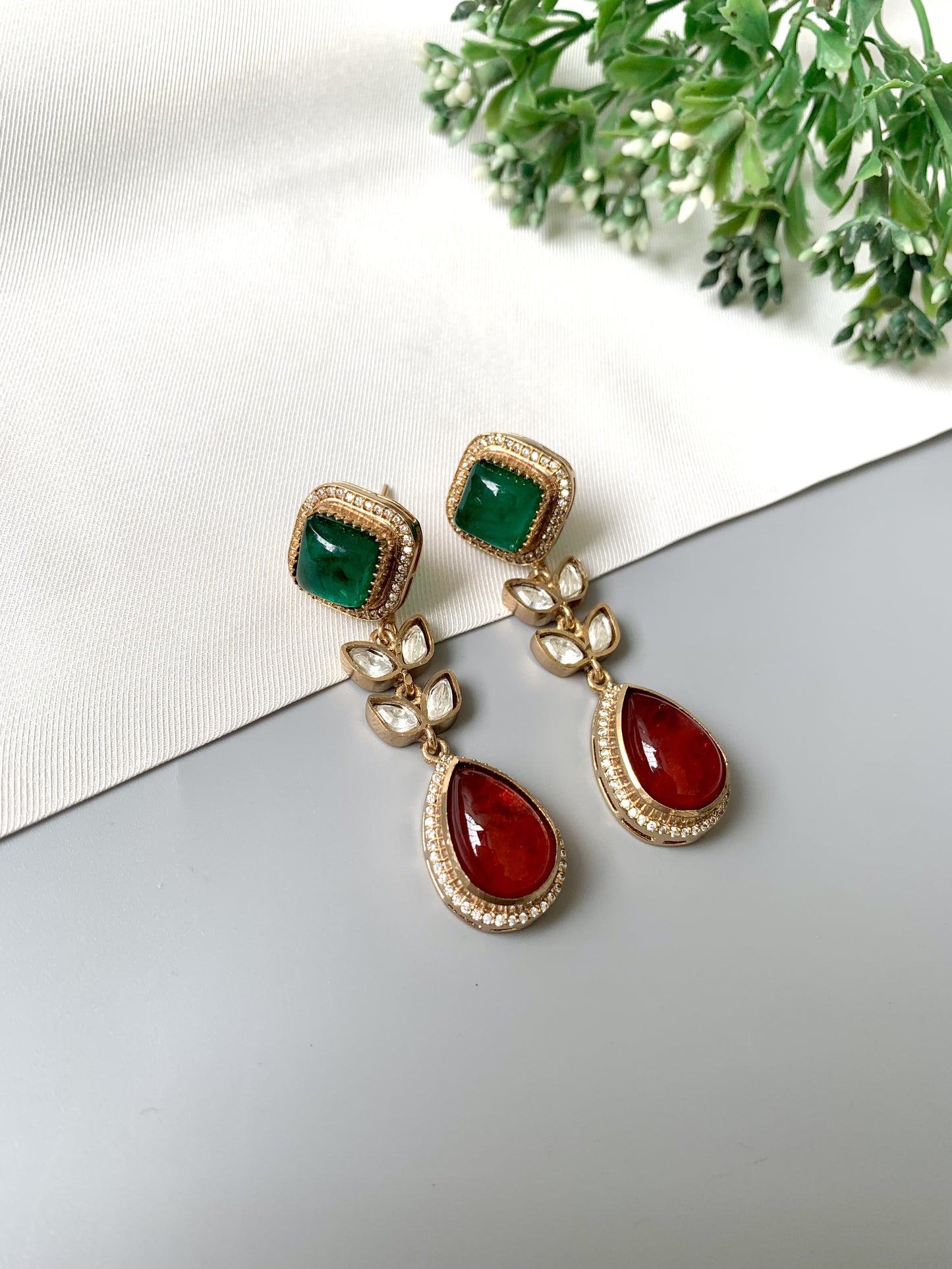 Elayra earrings in a ruby and emerald color combo with Victorian gold plating and handcrafted Kundan detailing