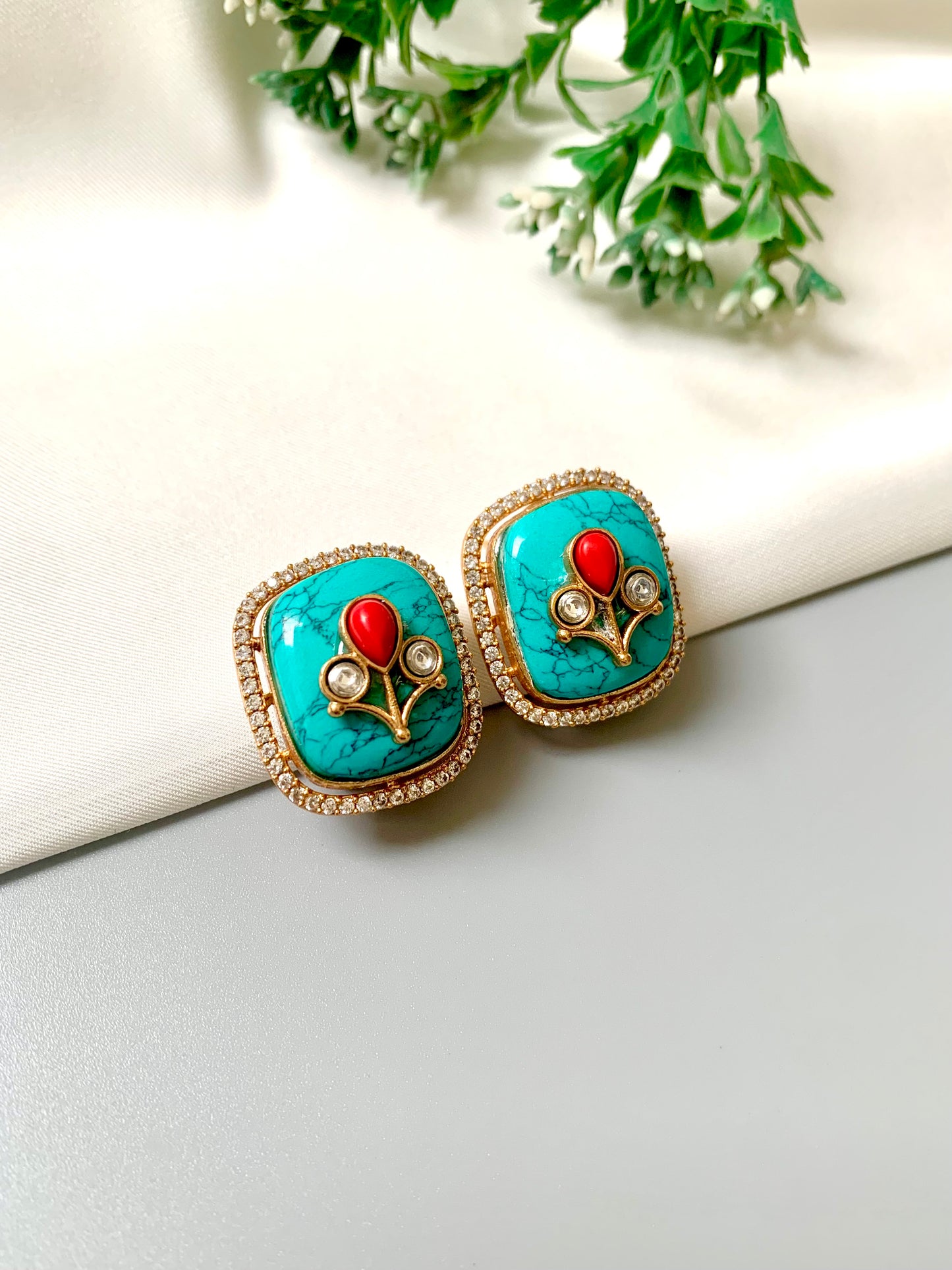Square-shaped gold studs with turquoise and red stone detailing – Zamal Jewels