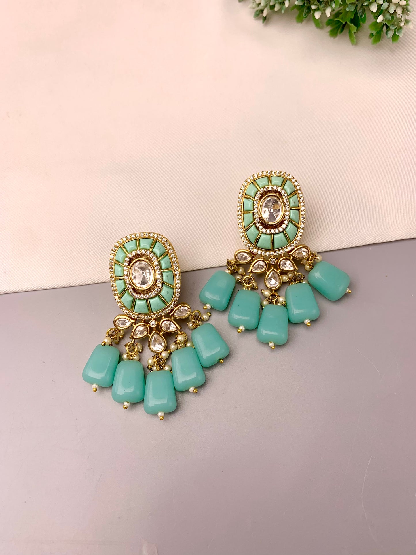 Irmah handcrafted 22kt gold plated earrings featuring American Diamonds, Polki Kundan, semi-precious Pearls, and Feroza