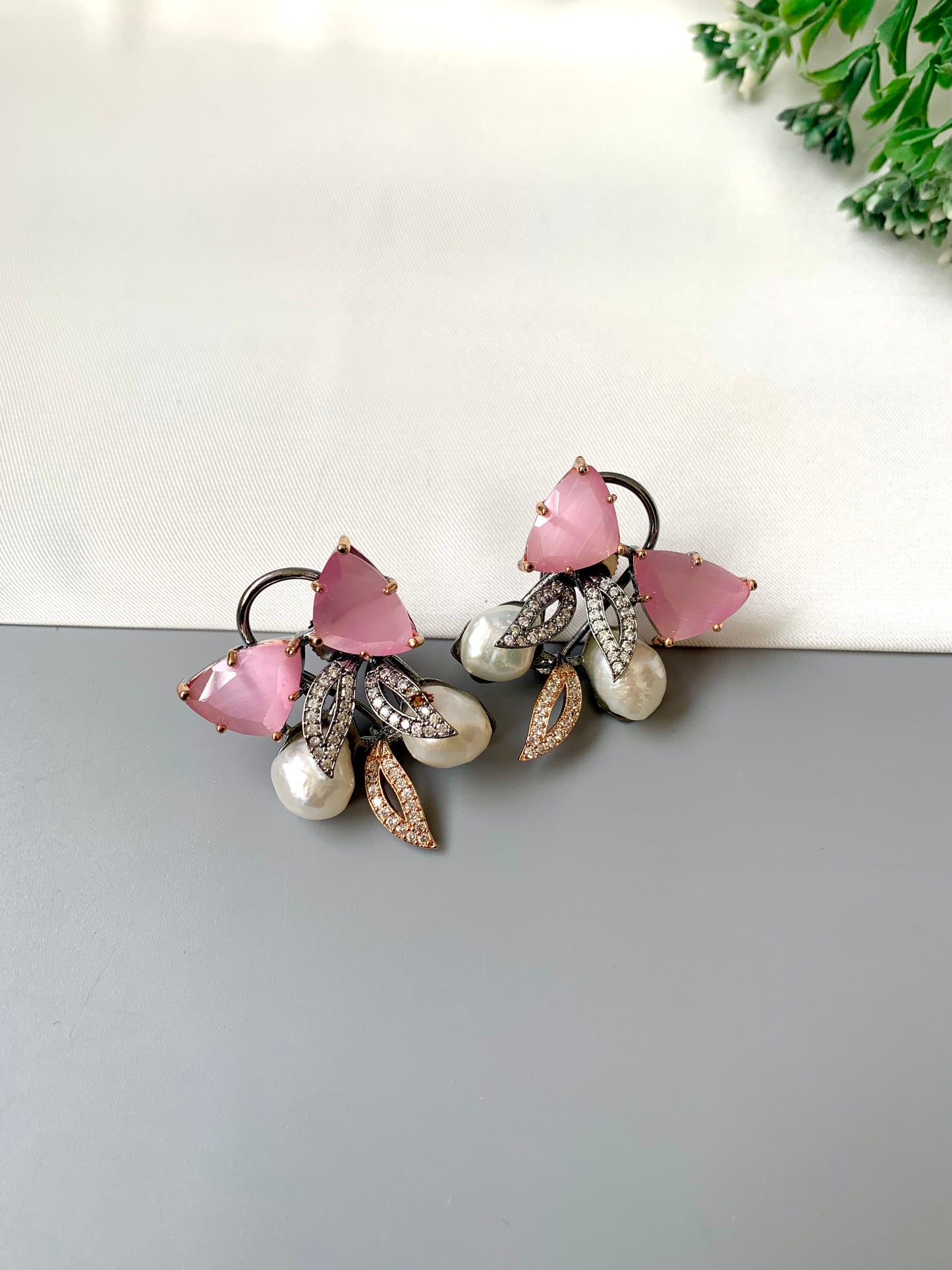 Ruby designer studs in rhodium diamond finish with baroque pearls and pink onyx stones