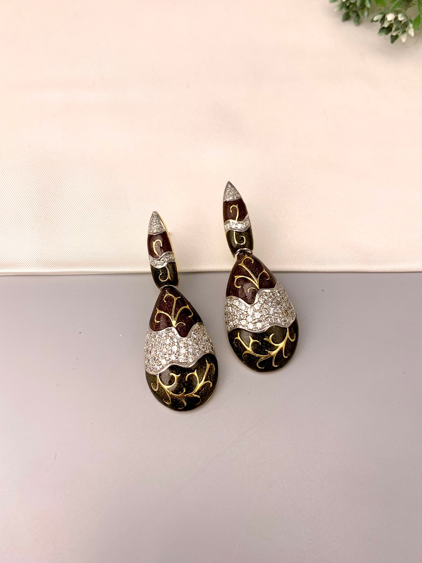Rayma handcrafted gold plated earrings with American diamonds and hand painted meena work