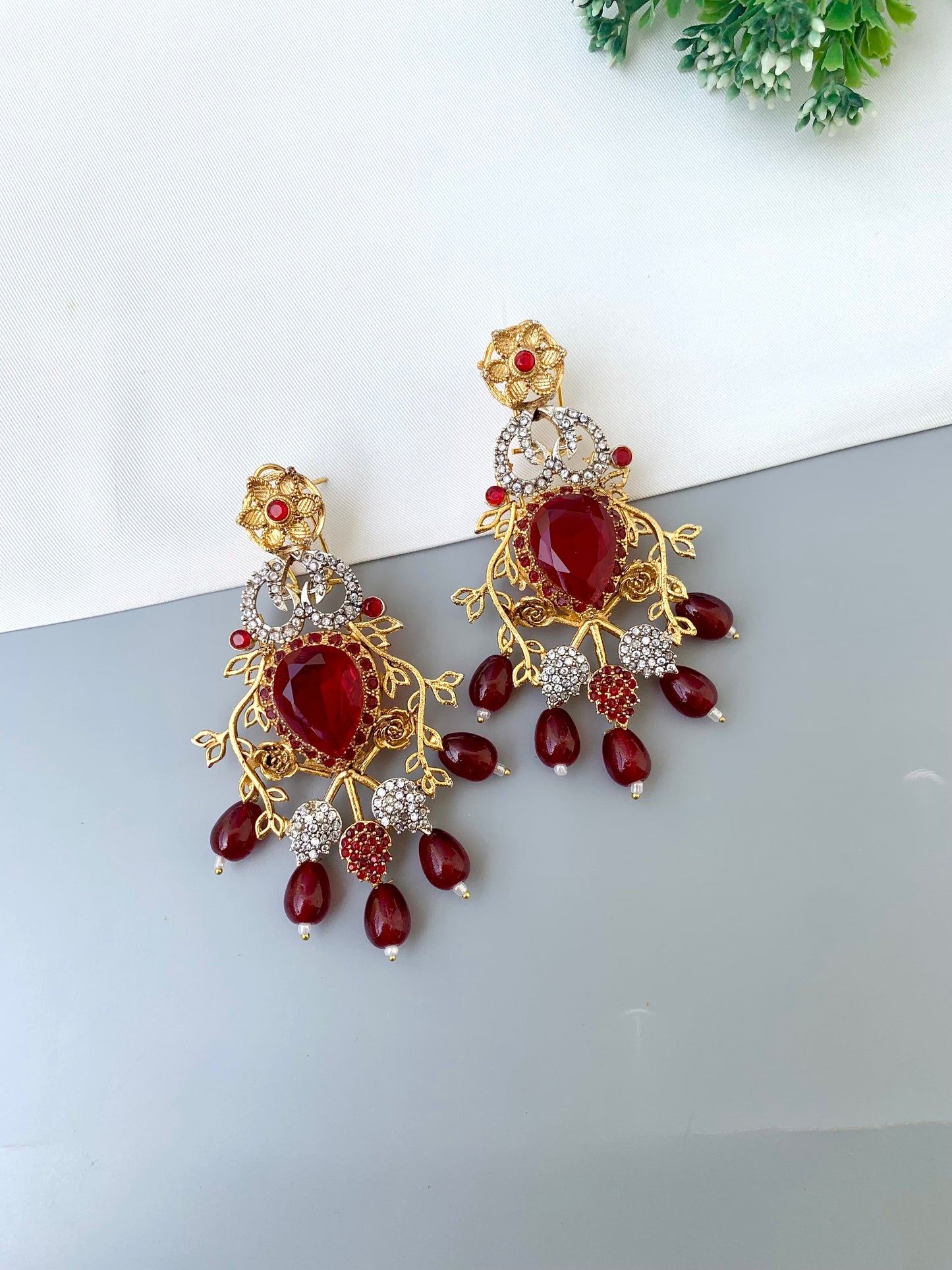 Sakeena ruby earrings in 22kt gold plating with American diamonds