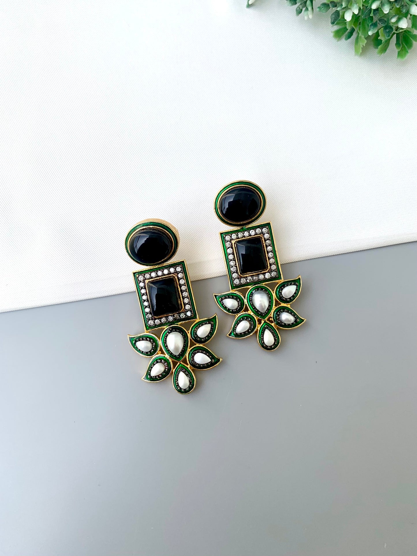 Sanah rhodium plated oxidized earrings with onyx pearls American diamonds and hand painted meena