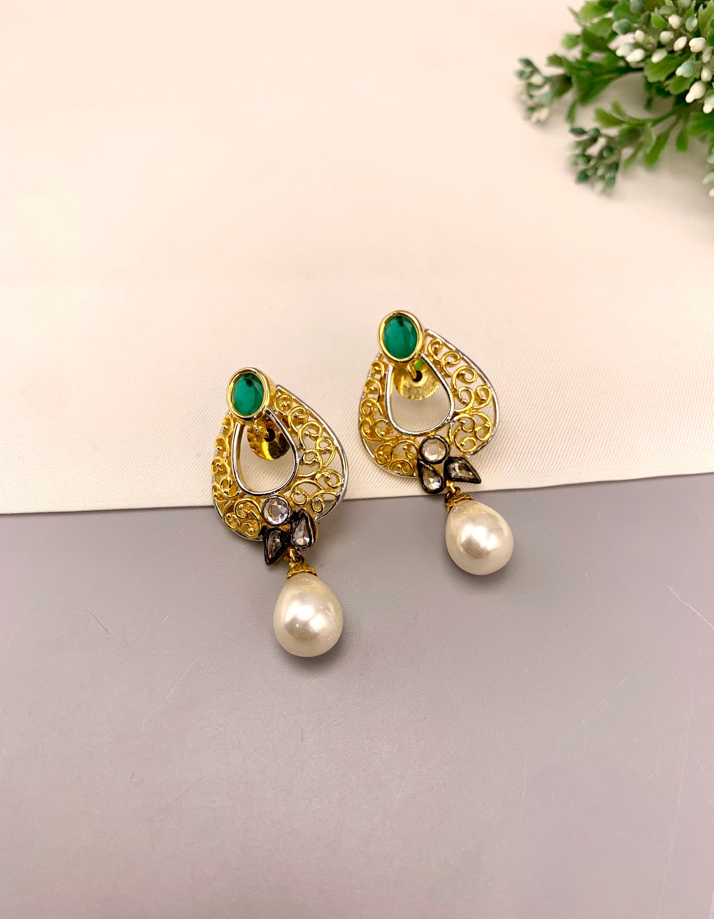 Savi handcrafted 22kt gold plated oxidized earrings with American Diamonds, semi-precious Emeralds and Pearls