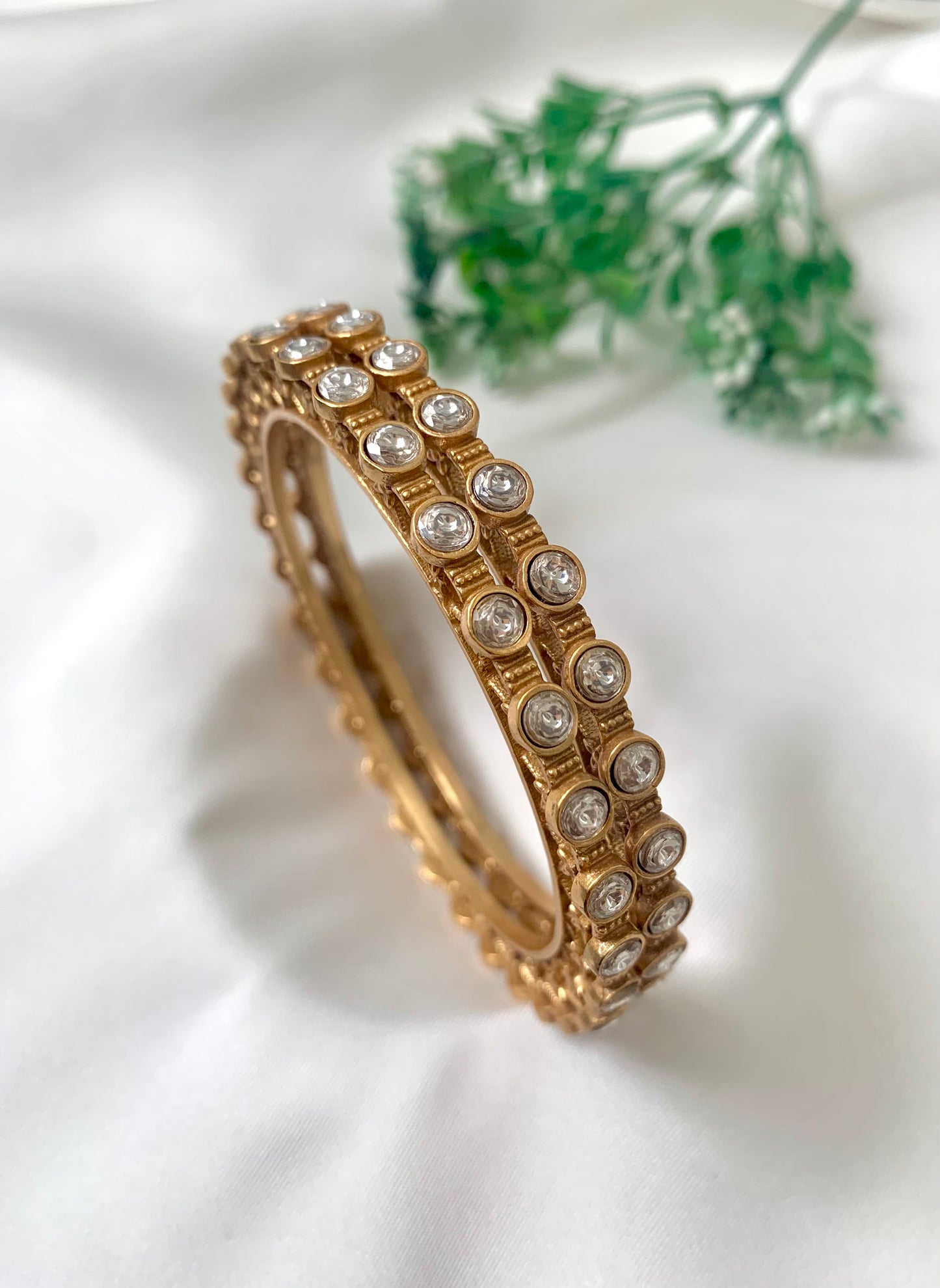 Serene handcrafted 22kt matte gold plated bangles with high quality Polki Kundan, sold as a pair