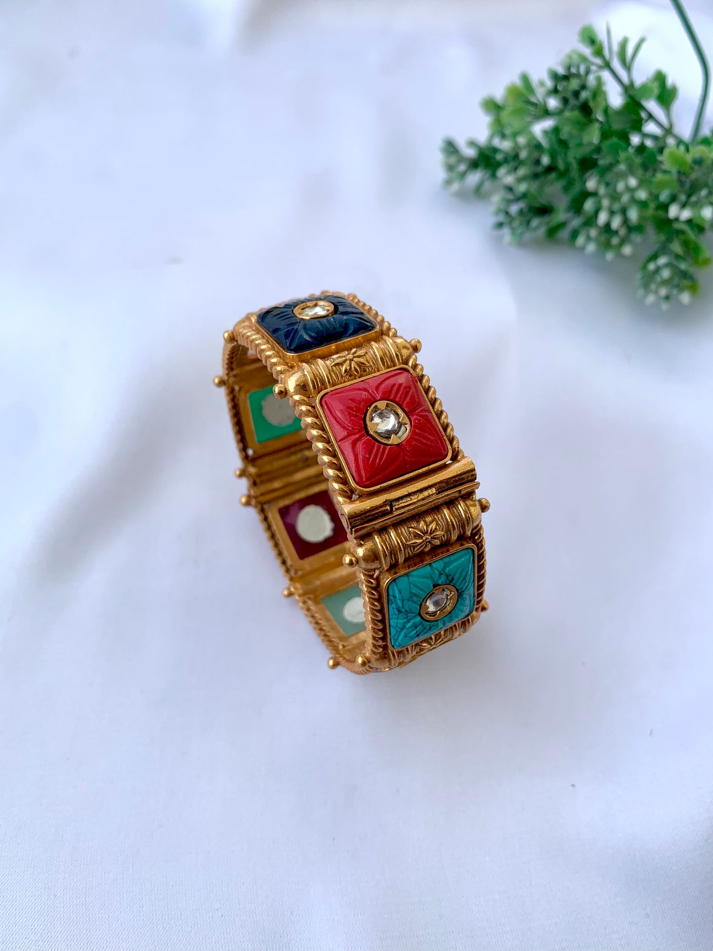 Handcrafted Arzella Bangle in 22kt gold plating with Polki Kundan and hand-carved Sapphire, Ruby, Emerald & Onyx stones