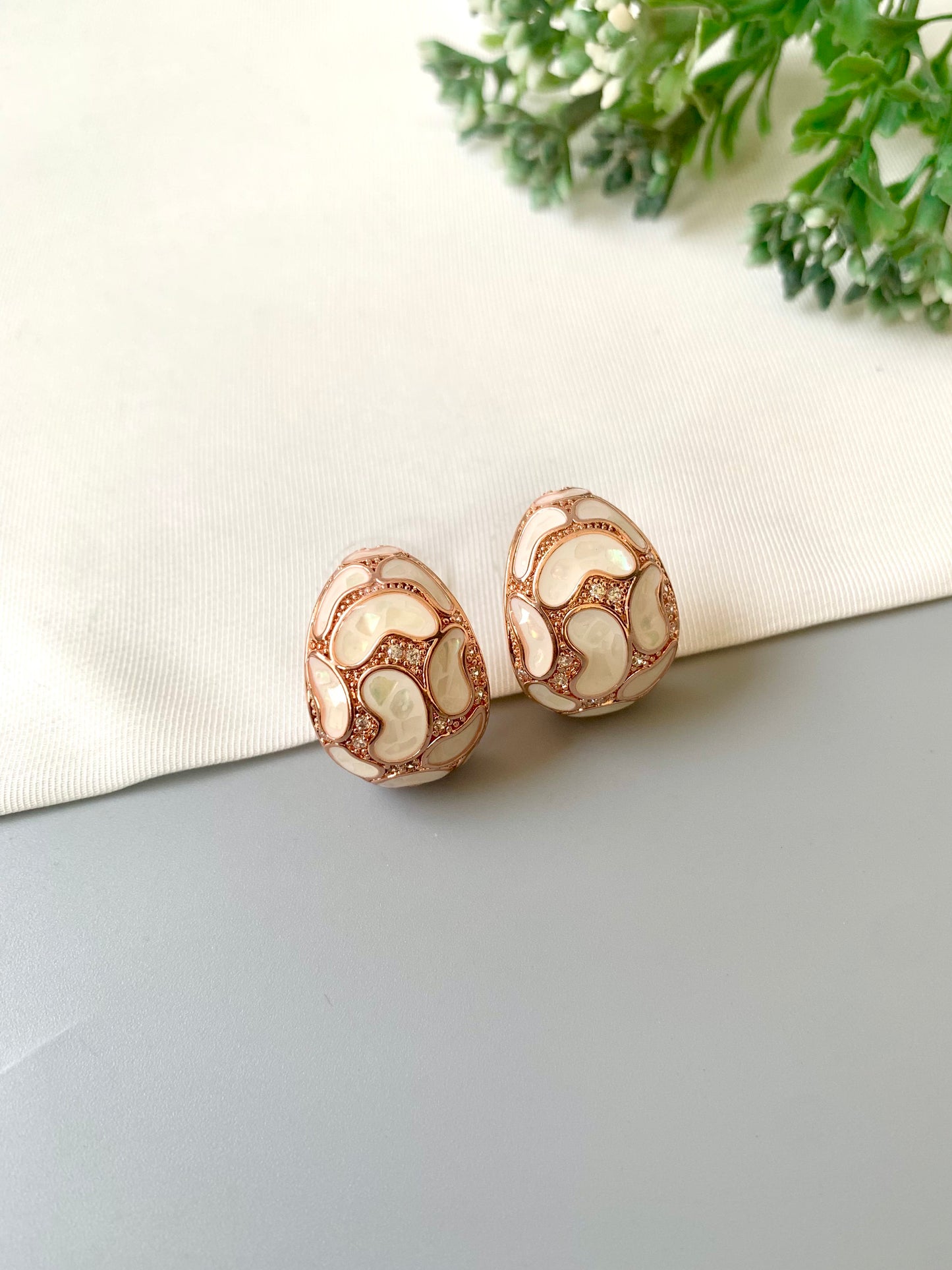 Handcrafted Auralie Studs in 22kt rose gold plating with real Mother of Pearl and American Diamonds by Zamal Jewels.
