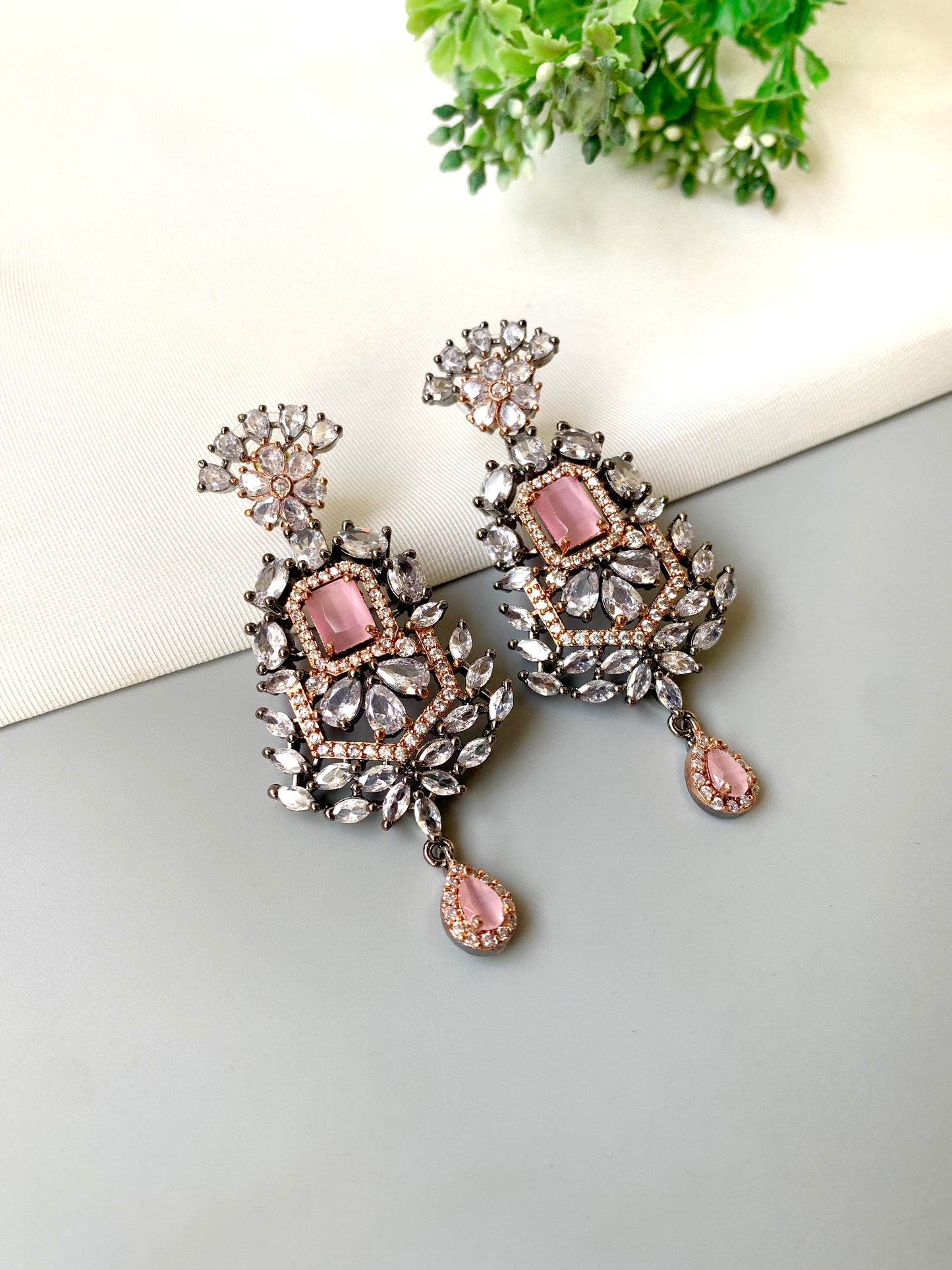 Handcrafted Nerina Rose Onyx Earrings in oxidized rose gold plating with American Diamonds and semi-precious onyx by Zamal Jewels.