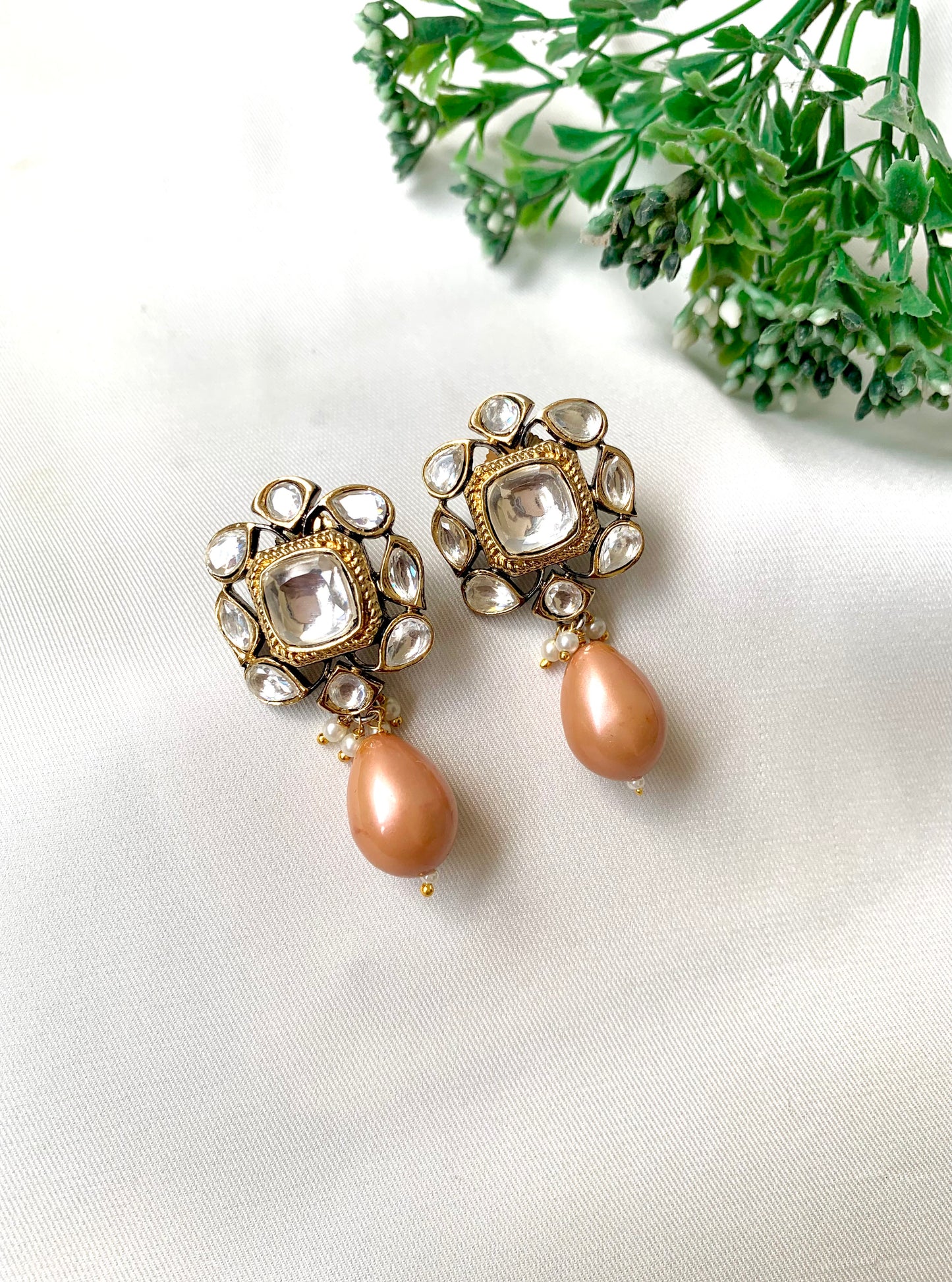Handcrafted Zareen Earrings in Peach Pearl with Polki Kundan stones and Victorian gold finish by Zamal Jewels