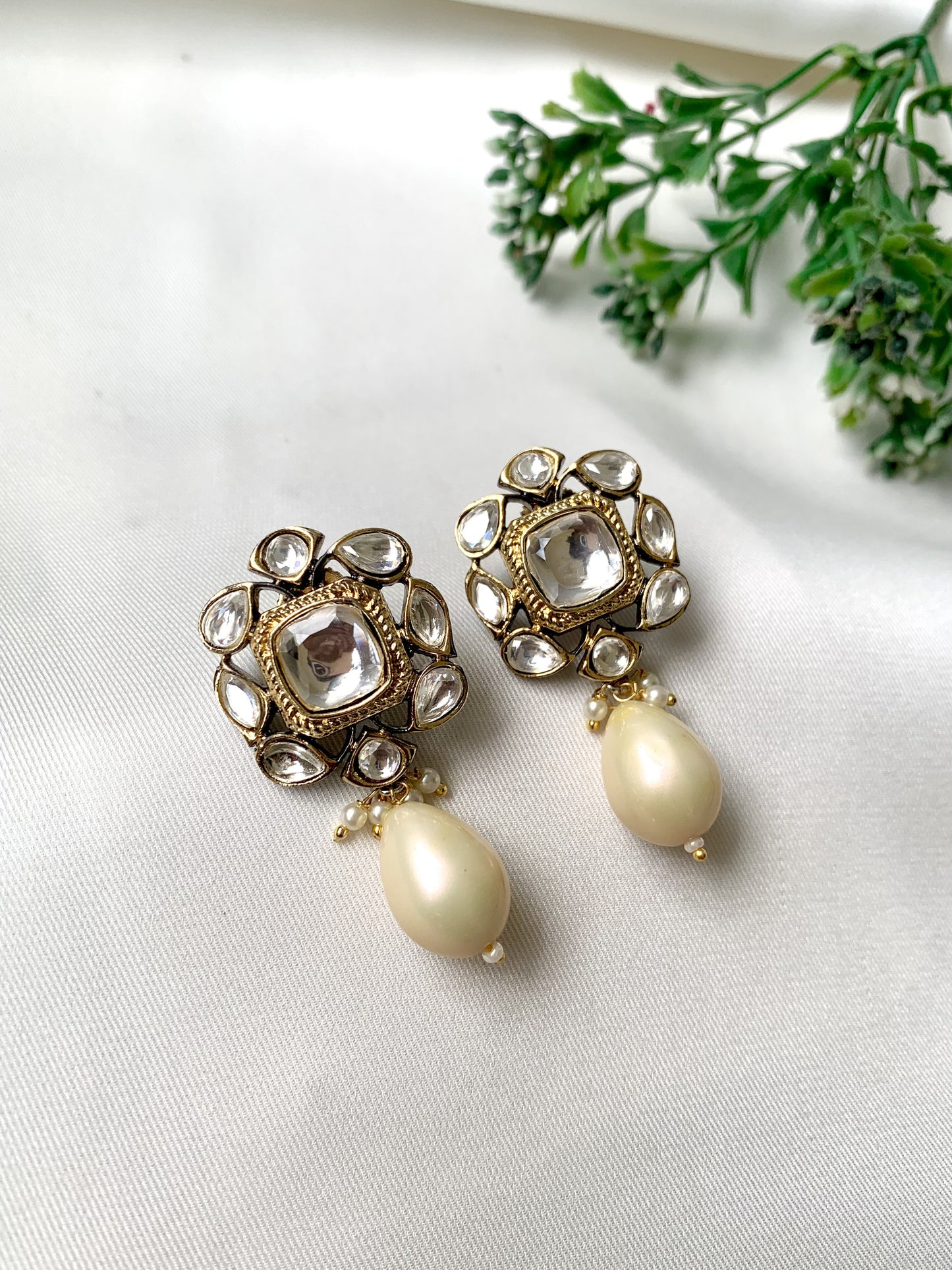 Handcrafted Zareen Earrings in White Pearl with Polki Kundan stones and Victorian gold finish by Zamal Jewels