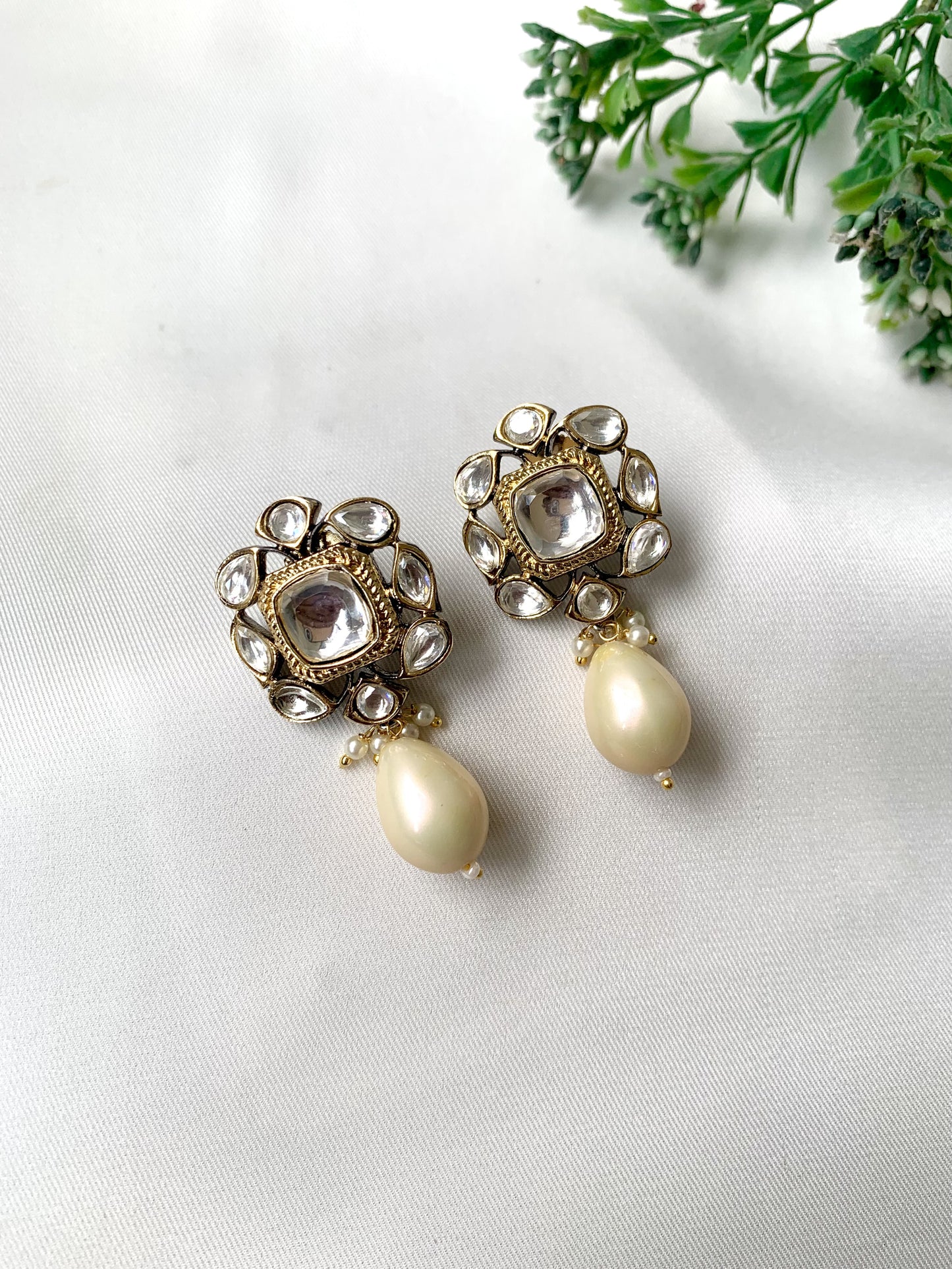 Handcrafted Zareen Earrings in White Pearl with Polki Kundan stones and Victorian gold finish by Zamal Jewels