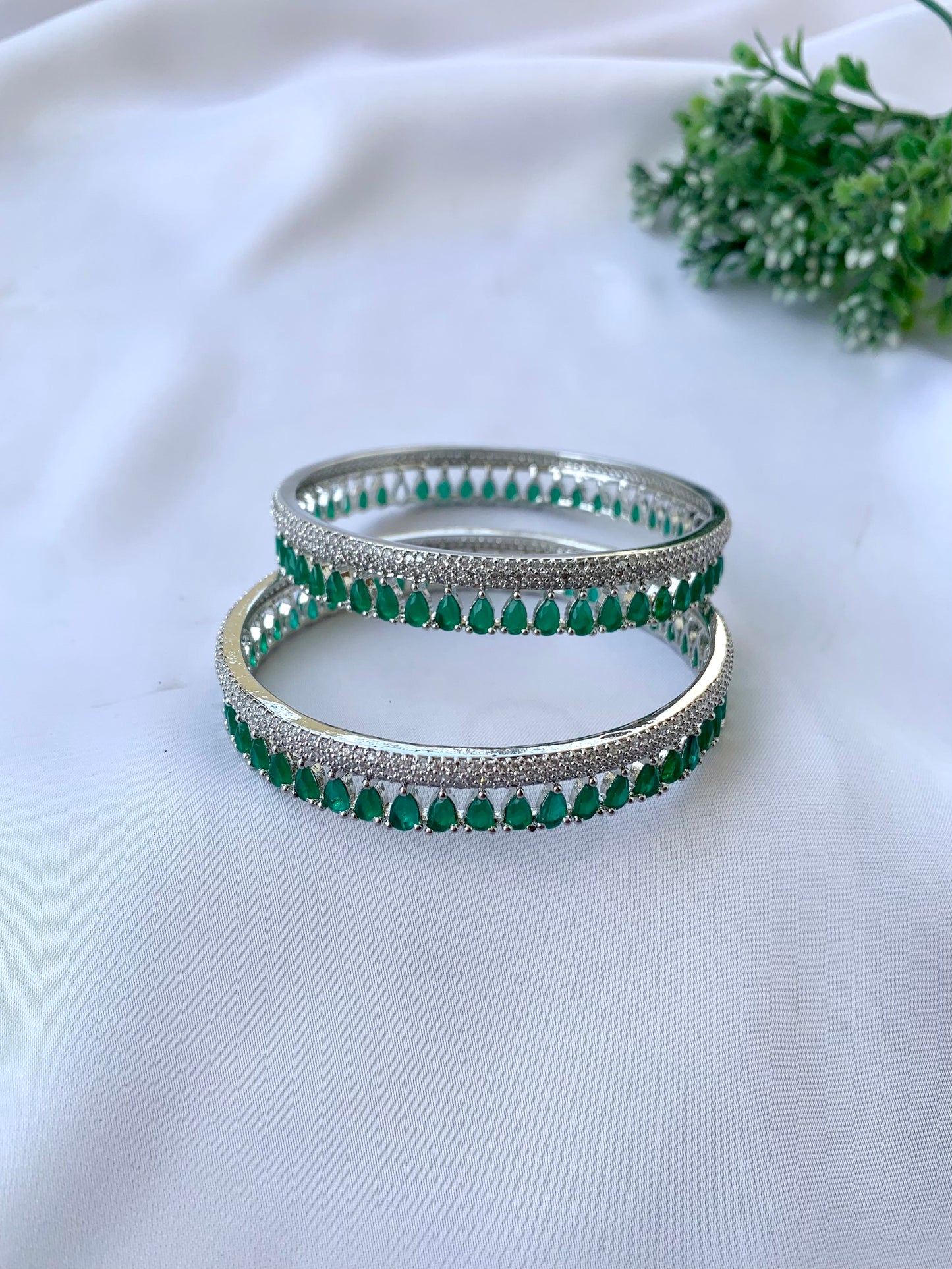 Zerina emerald rhodium plated slide on bangles in platinum finish with American diamonds