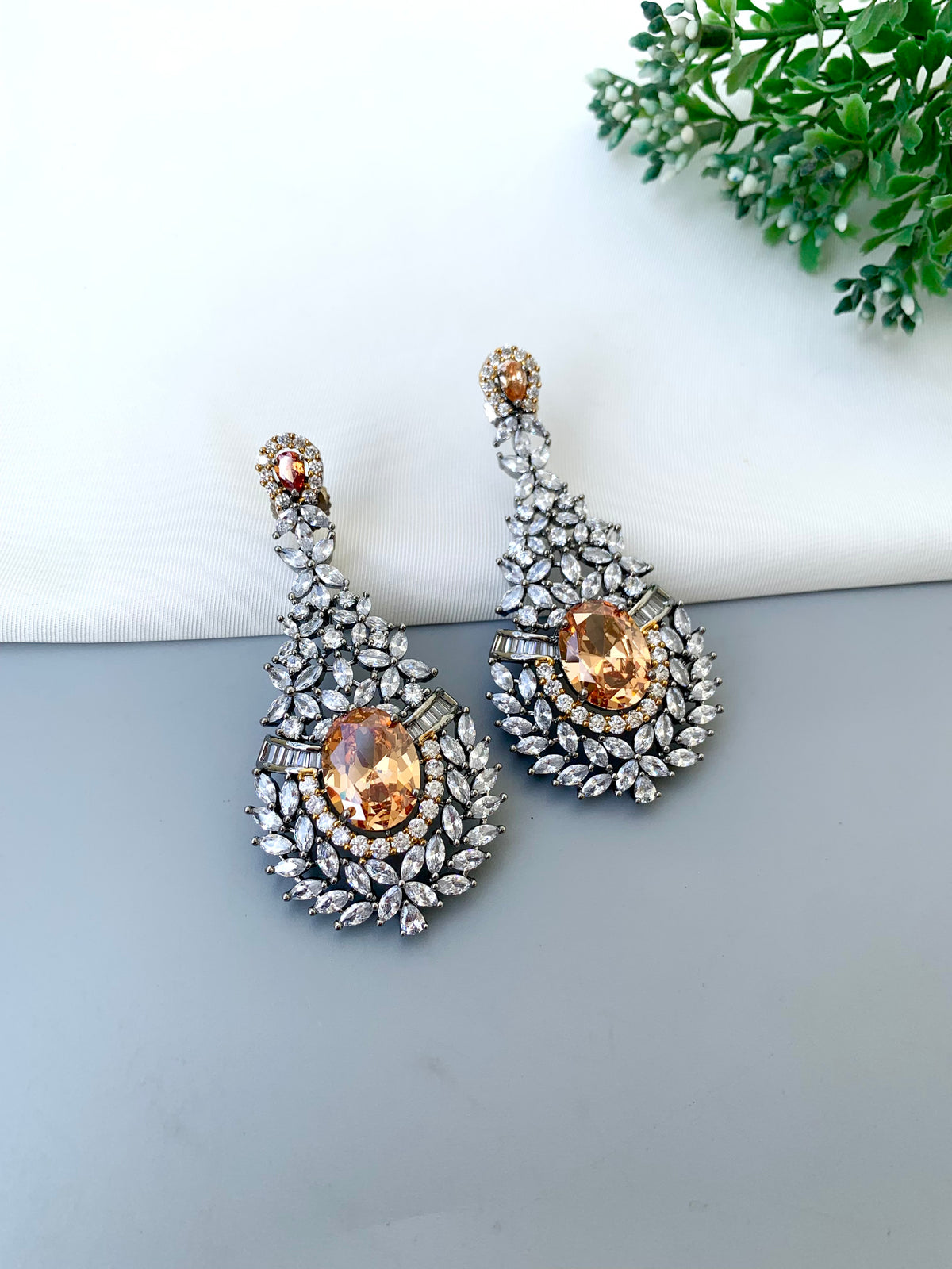 Ameera handcrafted oxidized Rhodium earrings with Victorian diamond finish, American Diamonds and Champagne stones