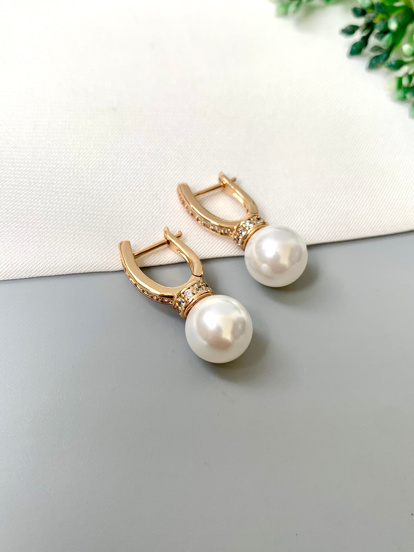 Luxurious pearl and diamond dangle earrings by Zamal Jewels