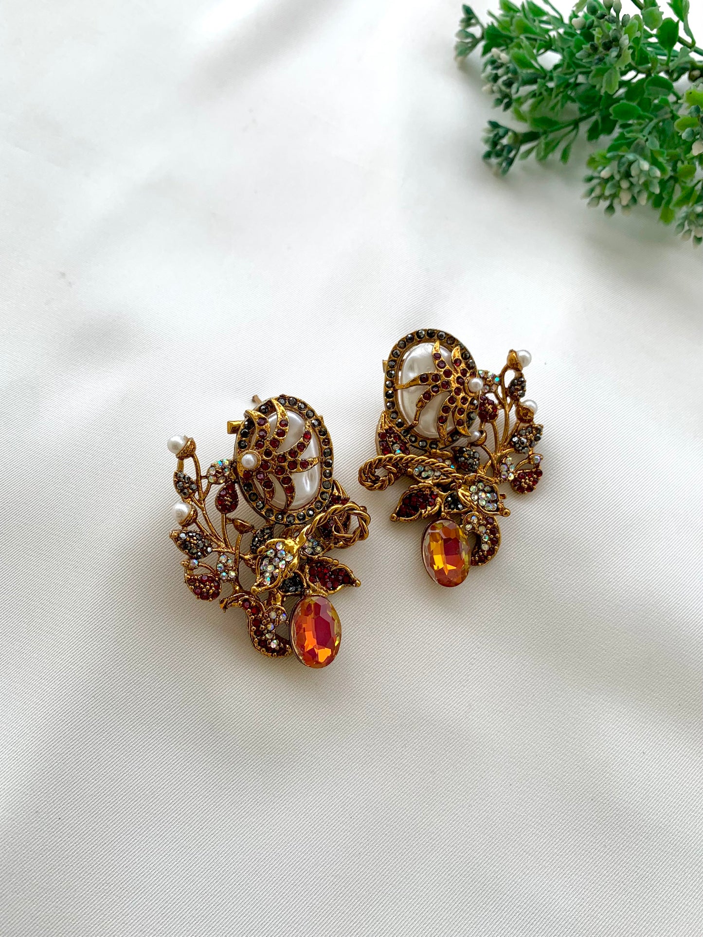 Arhaa handcrafted 22kt gold plated earrings featuring genuine Baroque Pearls, Marcasite crystals, and Pearls, available in Emerald, Champagne, Mint, and Citrine variants