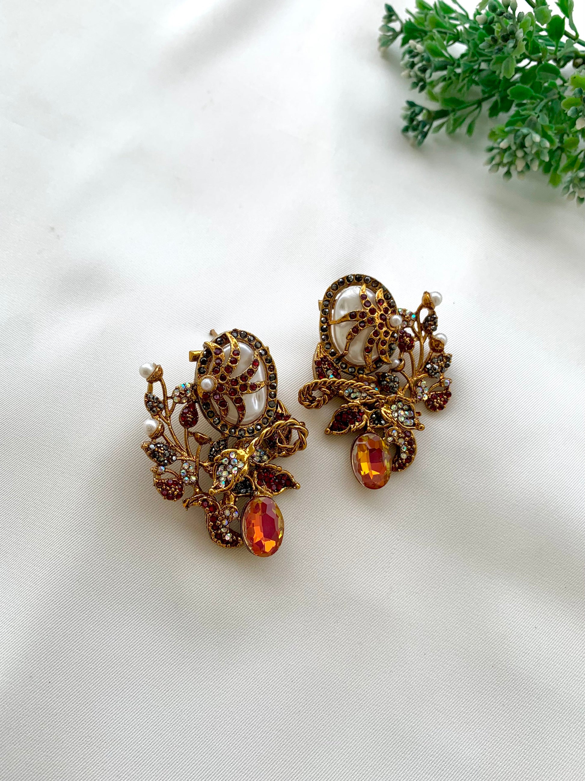 Arhaa handcrafted 22kt gold plated earrings featuring genuine Baroque Pearls, Marcasite crystals, and Pearls, available in Emerald, Champagne, Mint, and Citrine variants