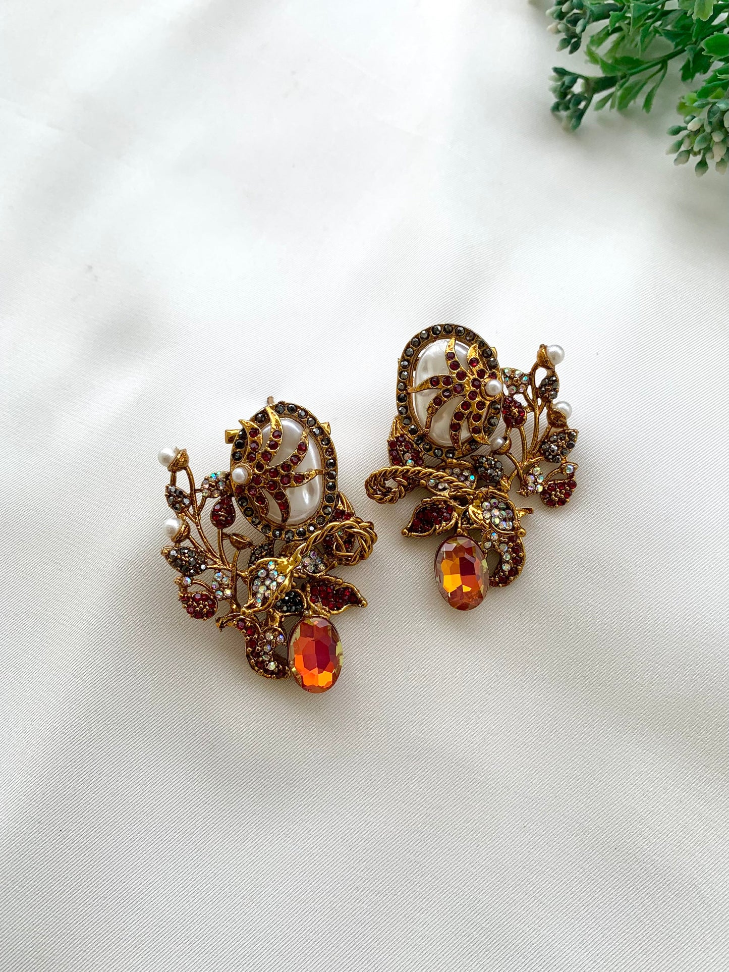Arhaa handcrafted 22kt gold plated earrings featuring genuine Baroque Pearls, Marcasite crystals, and Pearls, available in Emerald, Champagne, Mint, and Citrine variants