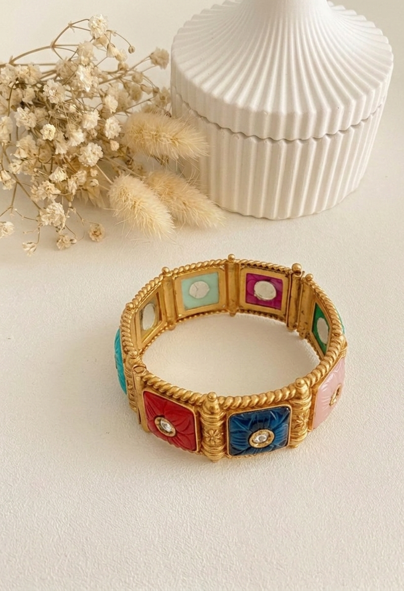 Handcrafted Arzella Bangle in 22kt gold plating with Polki Kundan and hand-carved Sapphire, Ruby, Emerald & Onyx stones