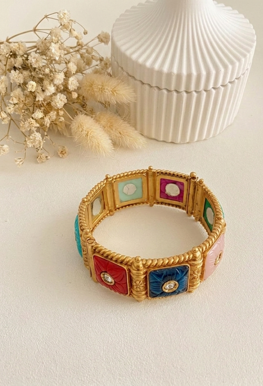 Handcrafted Arzella Bangle in 22kt gold plating with Polki Kundan and hand-carved Sapphire, Ruby, Emerald & Onyx stones