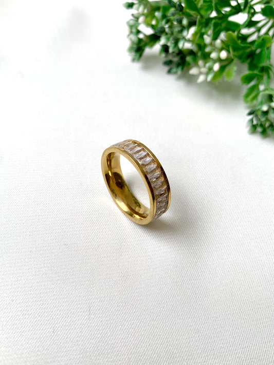 Brielle gold baguette-cut crystal band ring, 22K gold plated on 316L stainless steel by Zamal Jewels.