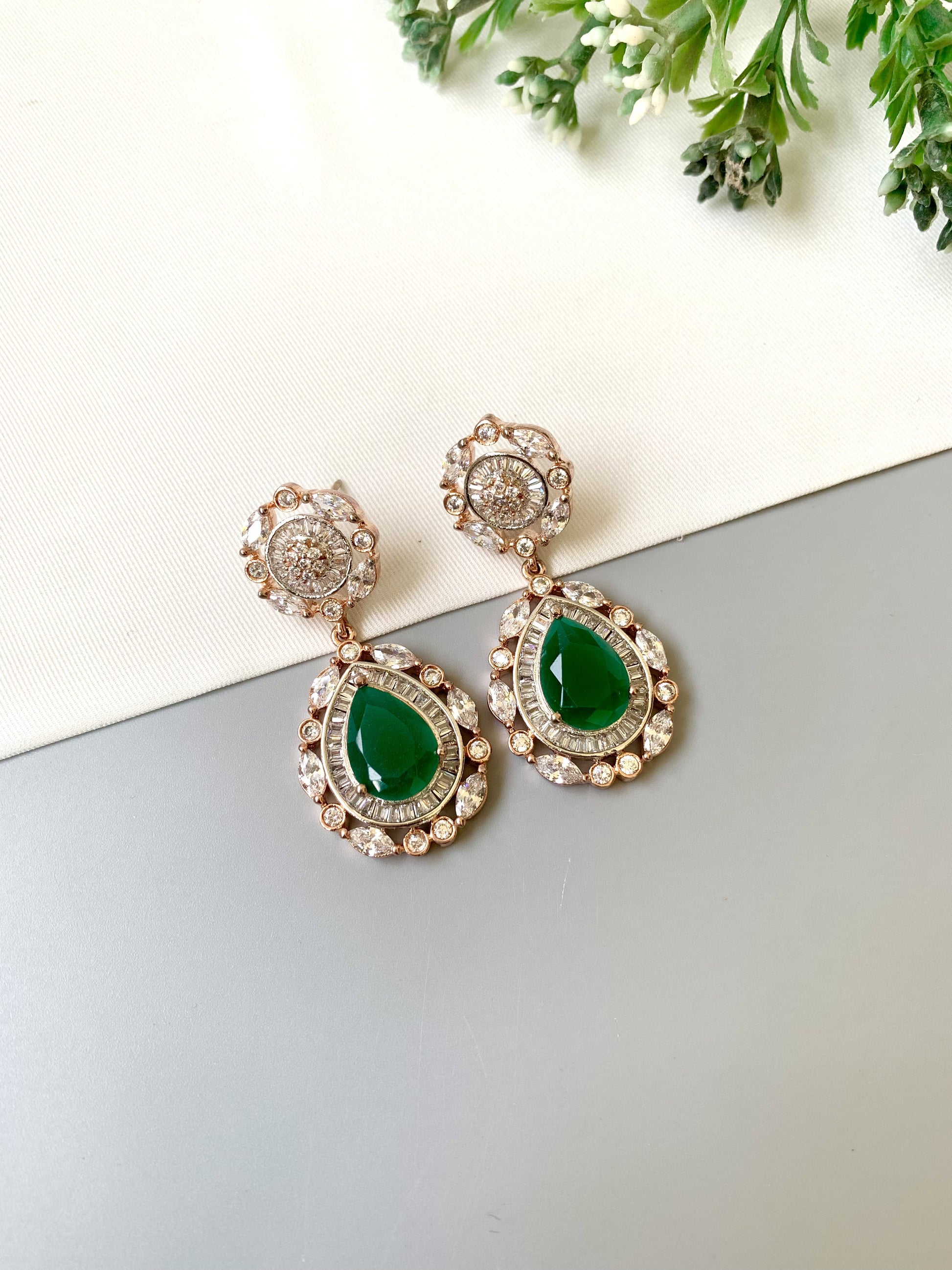 Handcrafted Victorian rose gold earrings with semi-precious emeralds and American diamonds by Zamal Jewels.