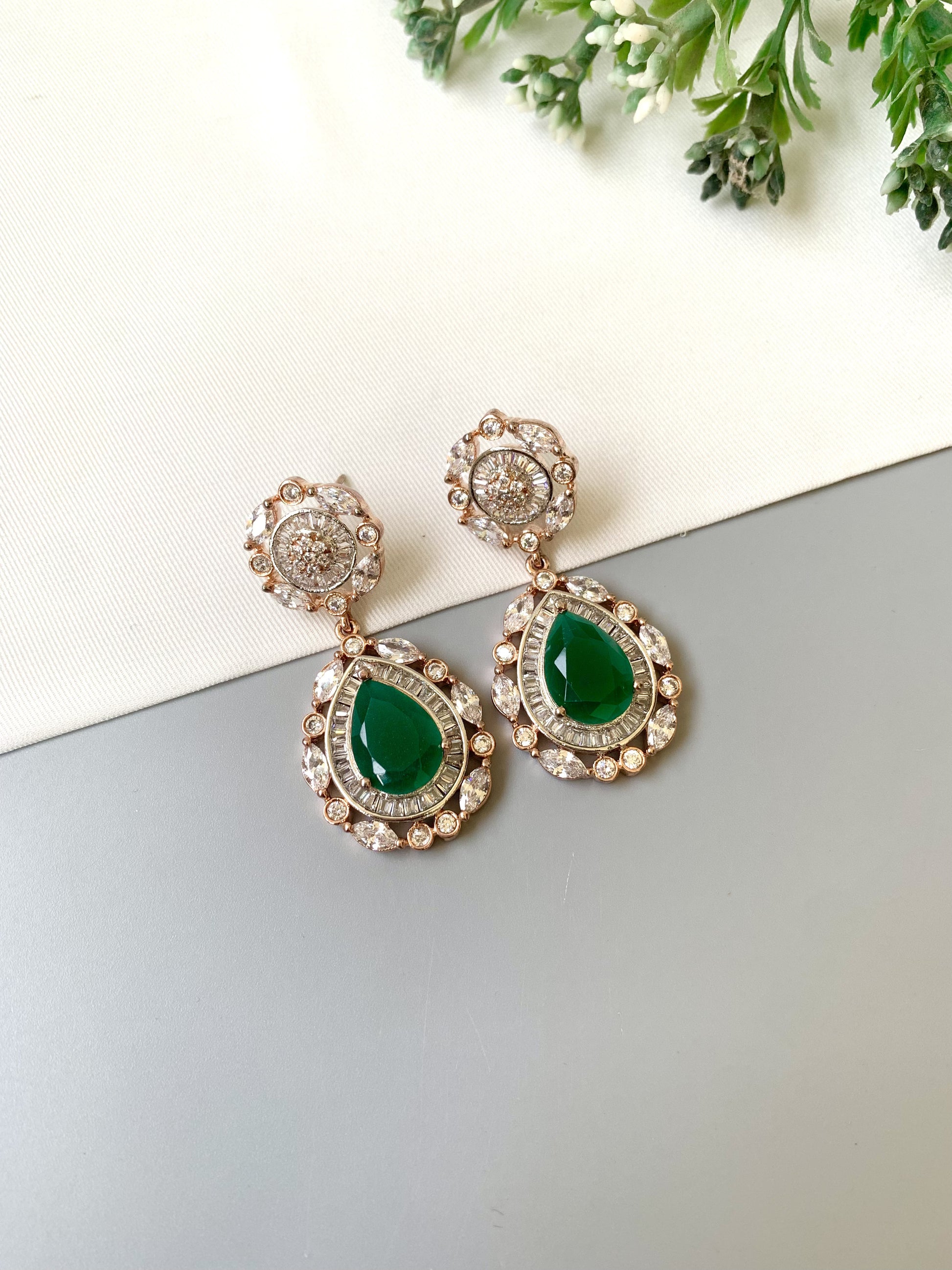 Handcrafted Victorian rose gold earrings with semi-precious emeralds and American diamonds by Zamal Jewels.